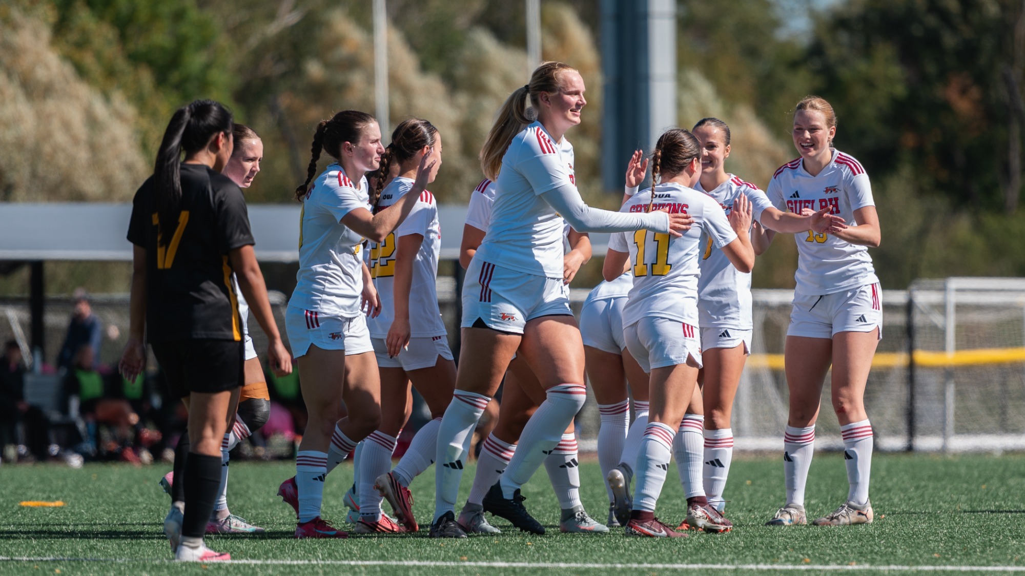 Gryphons women's soccer players celebrate a goal vs Waterloo on Oct. 4, 2026