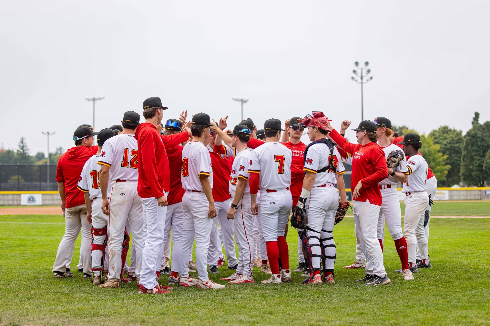 Gryphon baseball team huddle vs Windsor
