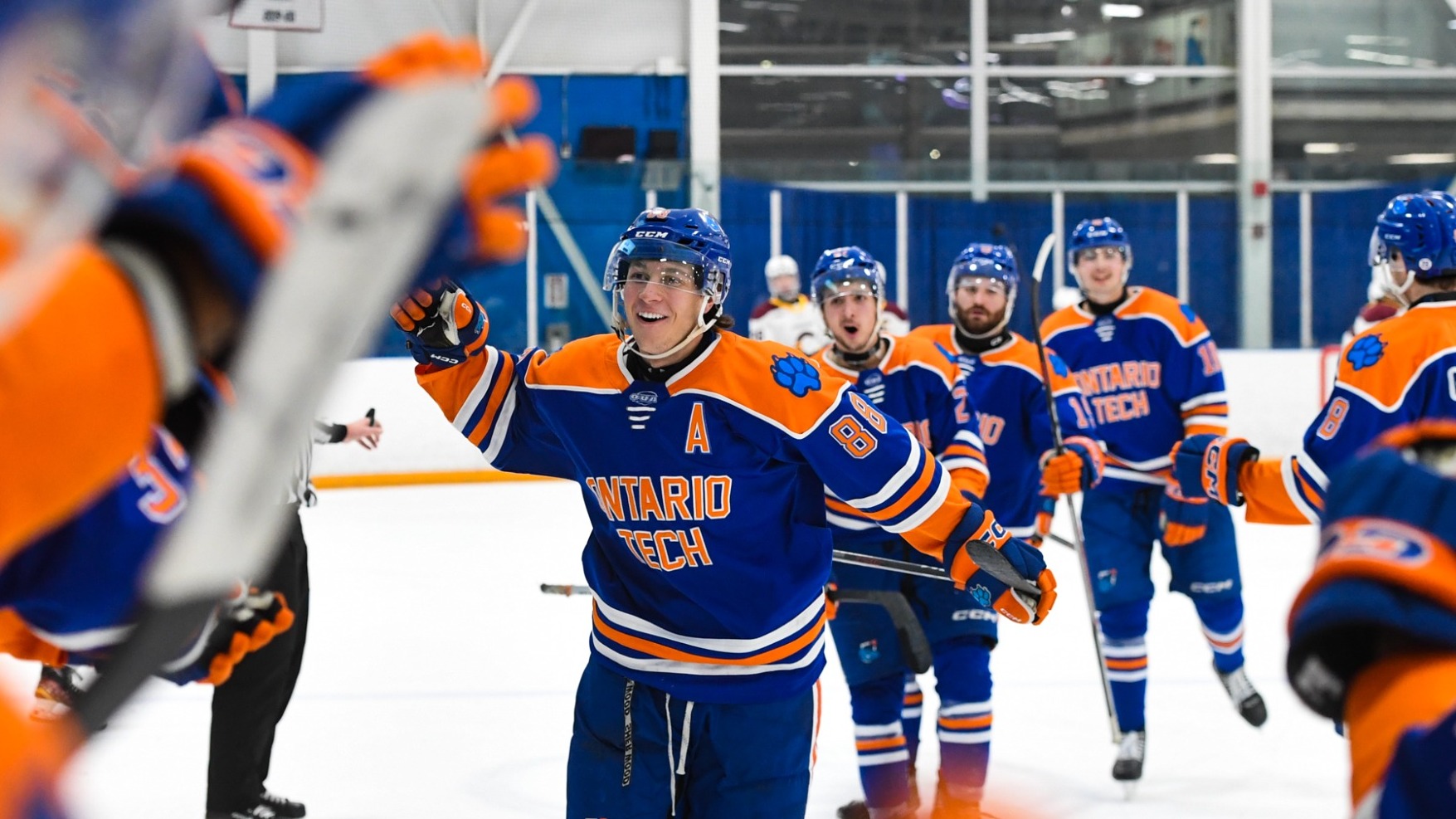 Gabriel Bernier skates to the Ridgebacks bench to celebrate a goal
