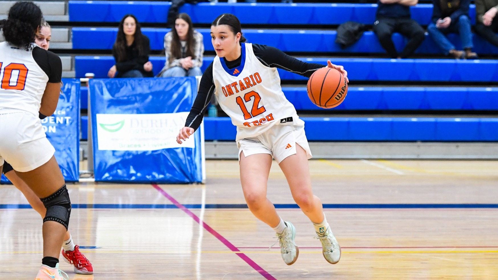 Adra dribbling a basketball