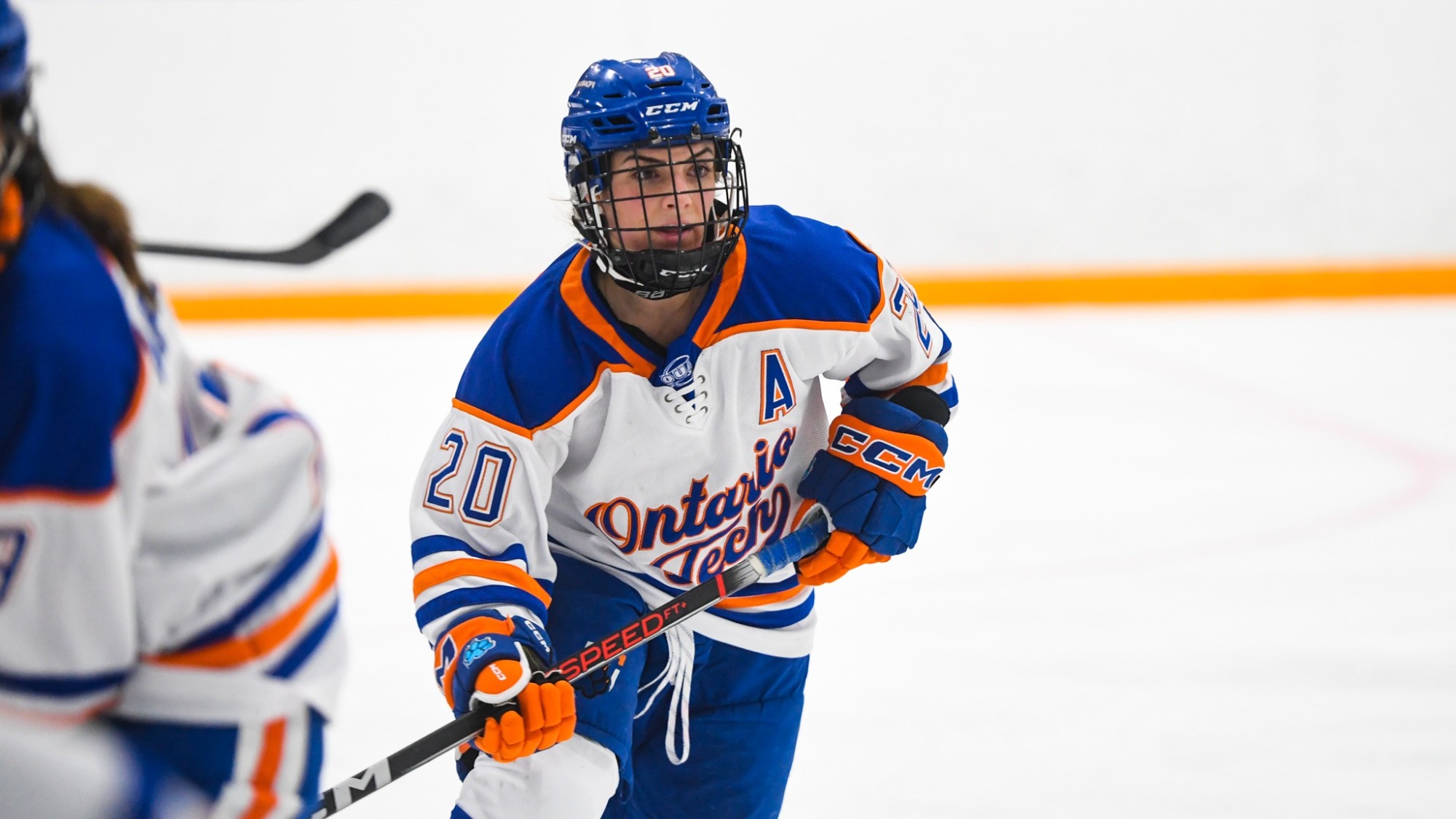 Perri skating during a hockey game.