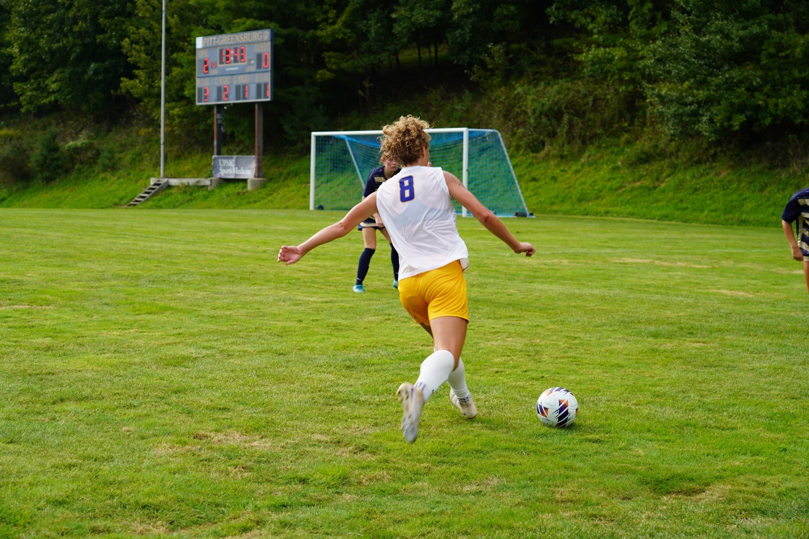 ella shooting soccer