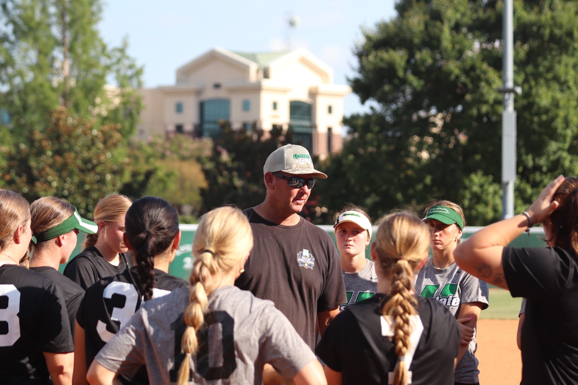 Coach Chris Hawkins talking to team after scrimmage