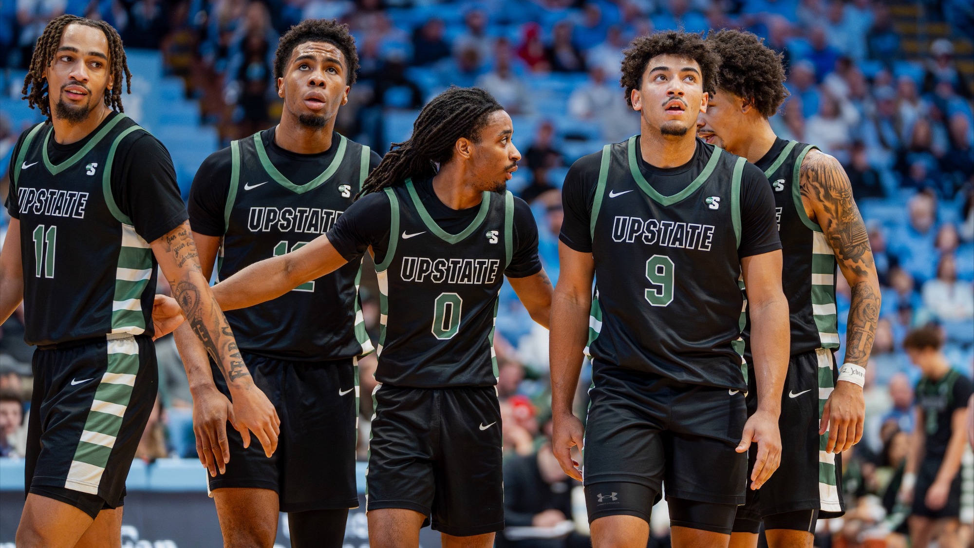 Upstate Men's Basketball after a team huddle at UNC (12/13/25)