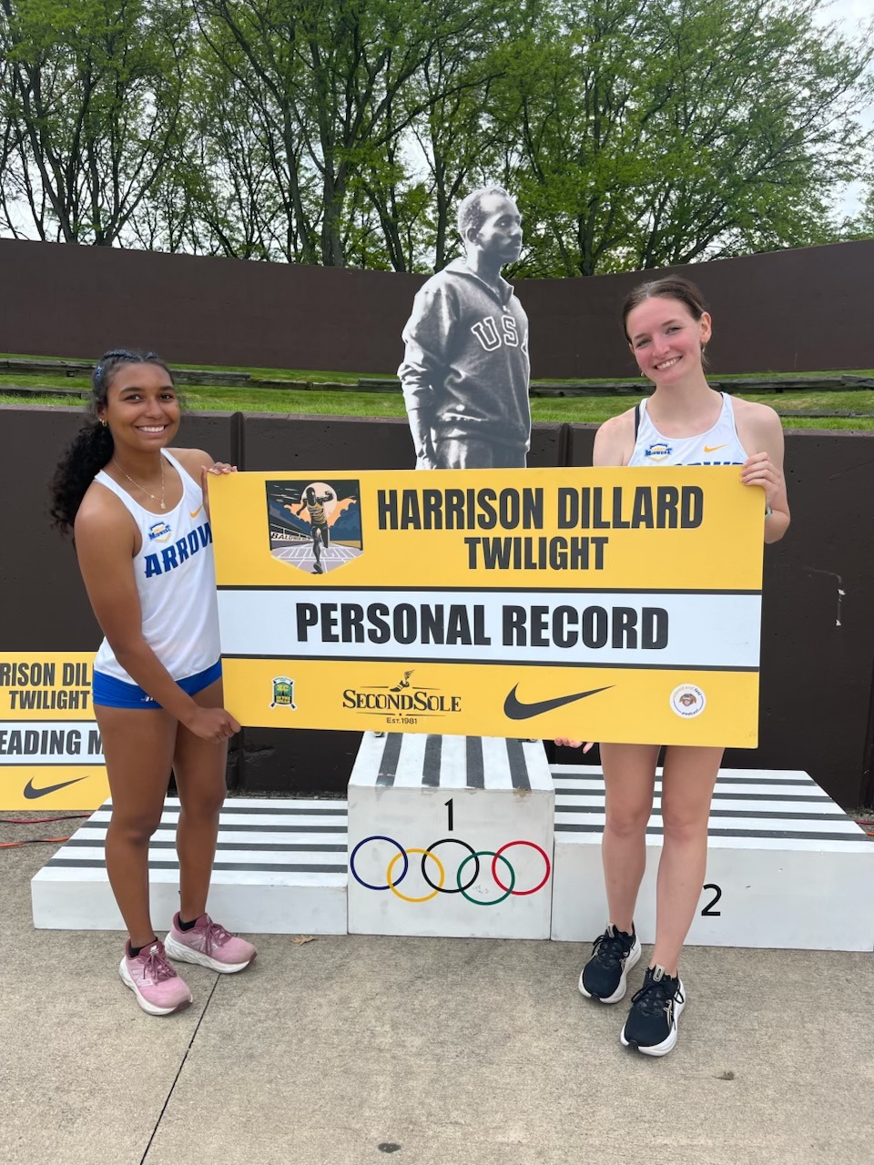 Kayla and Dom hold PR sign