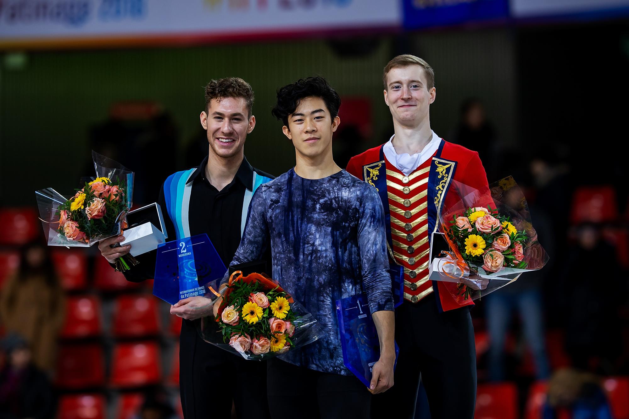 Jason Brown of the United States, Nathan Chen of the United States and Alexander Samarin of Russia pose in the Men's medal ceremony during day 2 of the ISU Grand Prix of Figure Skating Internationaux de France at Polesud Ice Skating Rink on November 24, 2018 in Grenoble, France. (Photo by Joosep Martinson - International Skating Union (ISU)/ISU via Getty Images)
