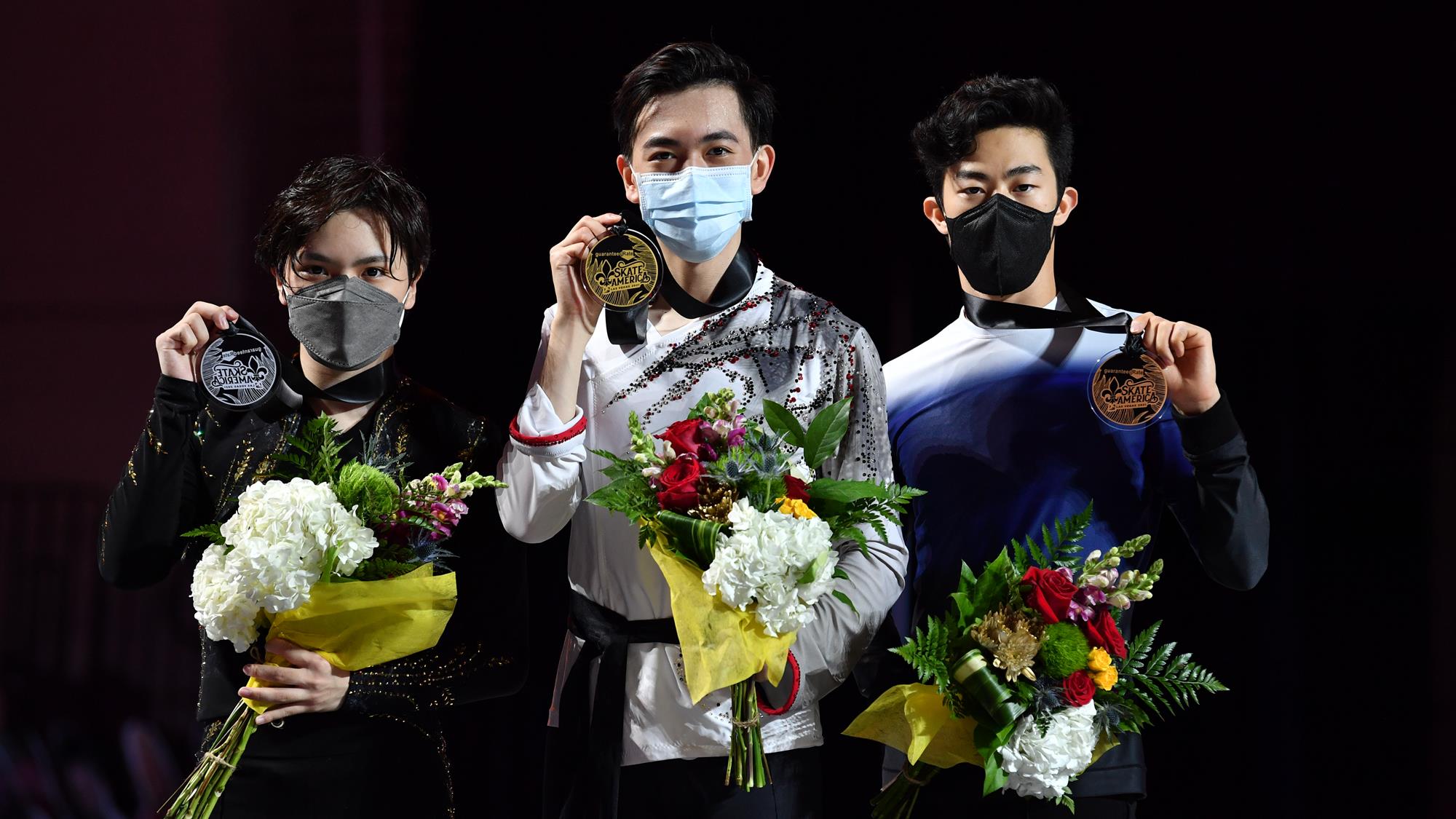 Men's podium at 2021 Skate America: Vincent Zhou (g), Shoma Uno (s), Nathan Chen (b)