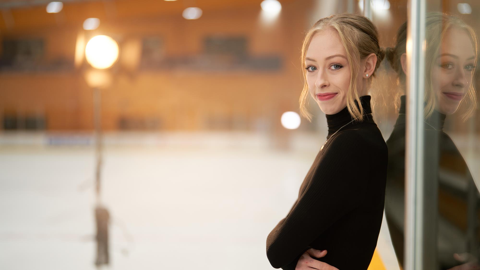 Bradie Tennell poses on rink boards for magazine photo shoot