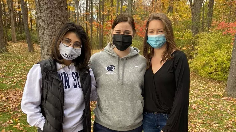 Dalia Rivkin and Penn State skaters off the ice