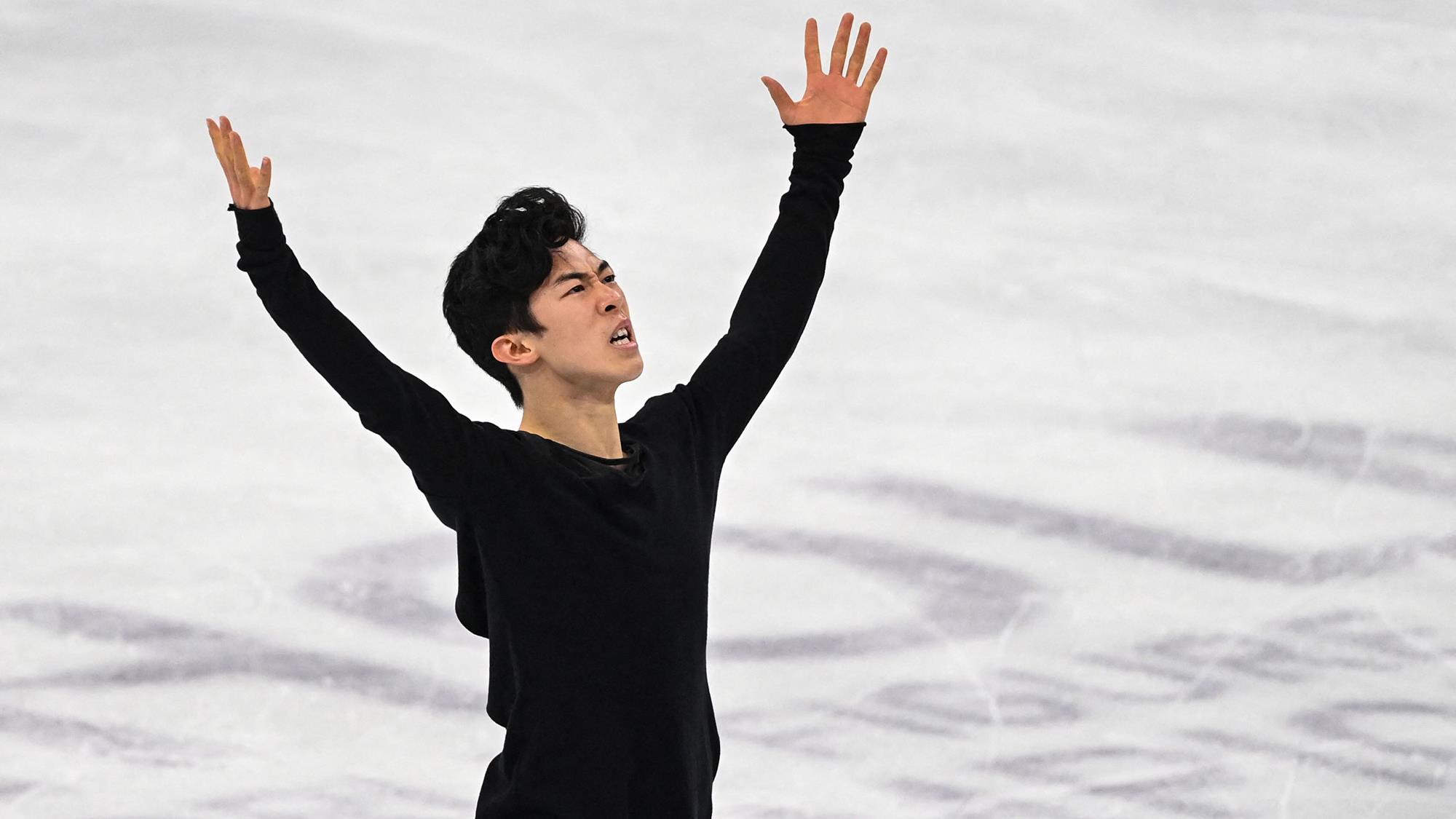 Nathan Chen poses at the end of his winning free skate at the 2021 World Championships