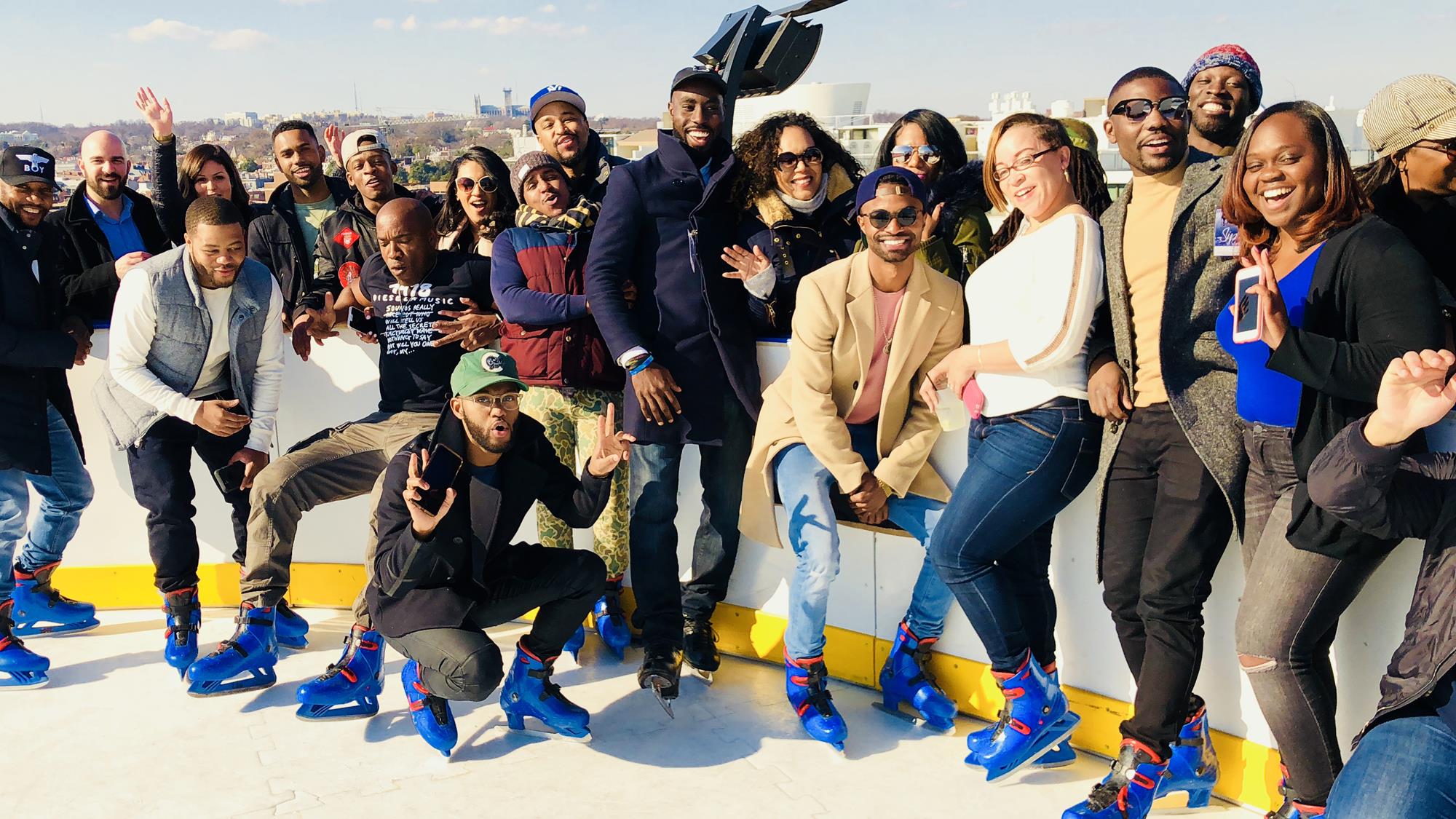 Group poses at a Diversify Ice Skate Raiser