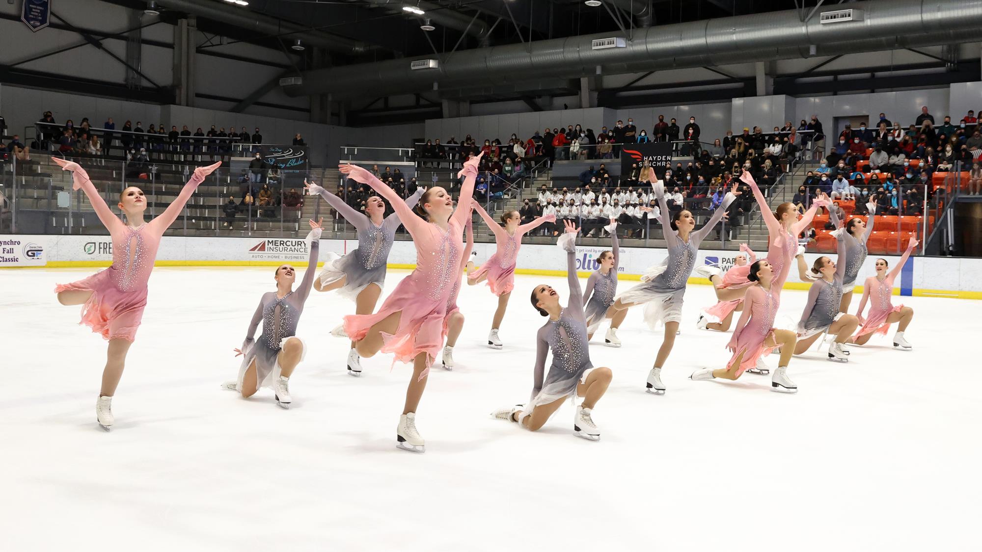 Hockettes skate in pink and grey dresses