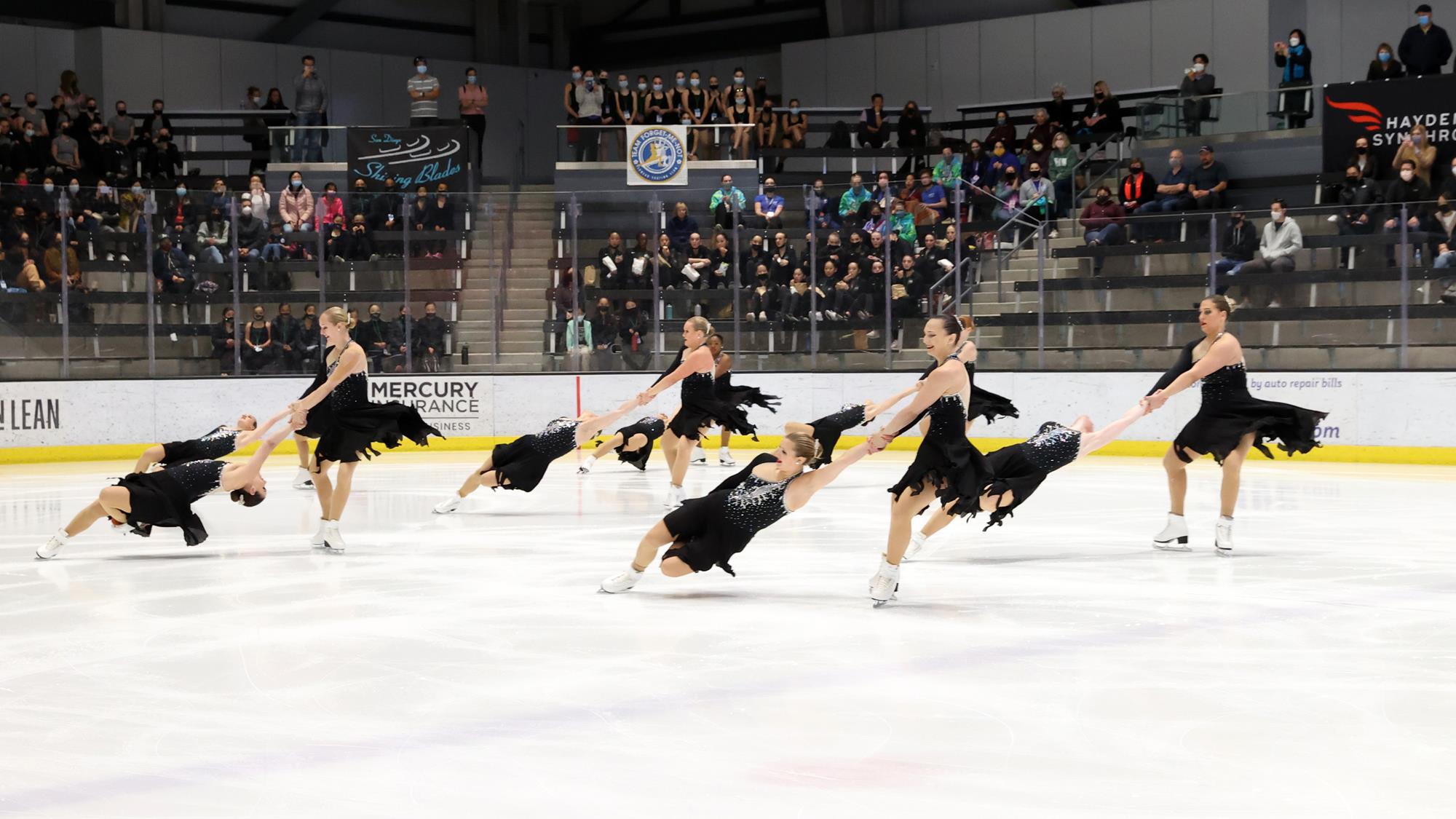 Skyliners perform a death spiral in black dresses
