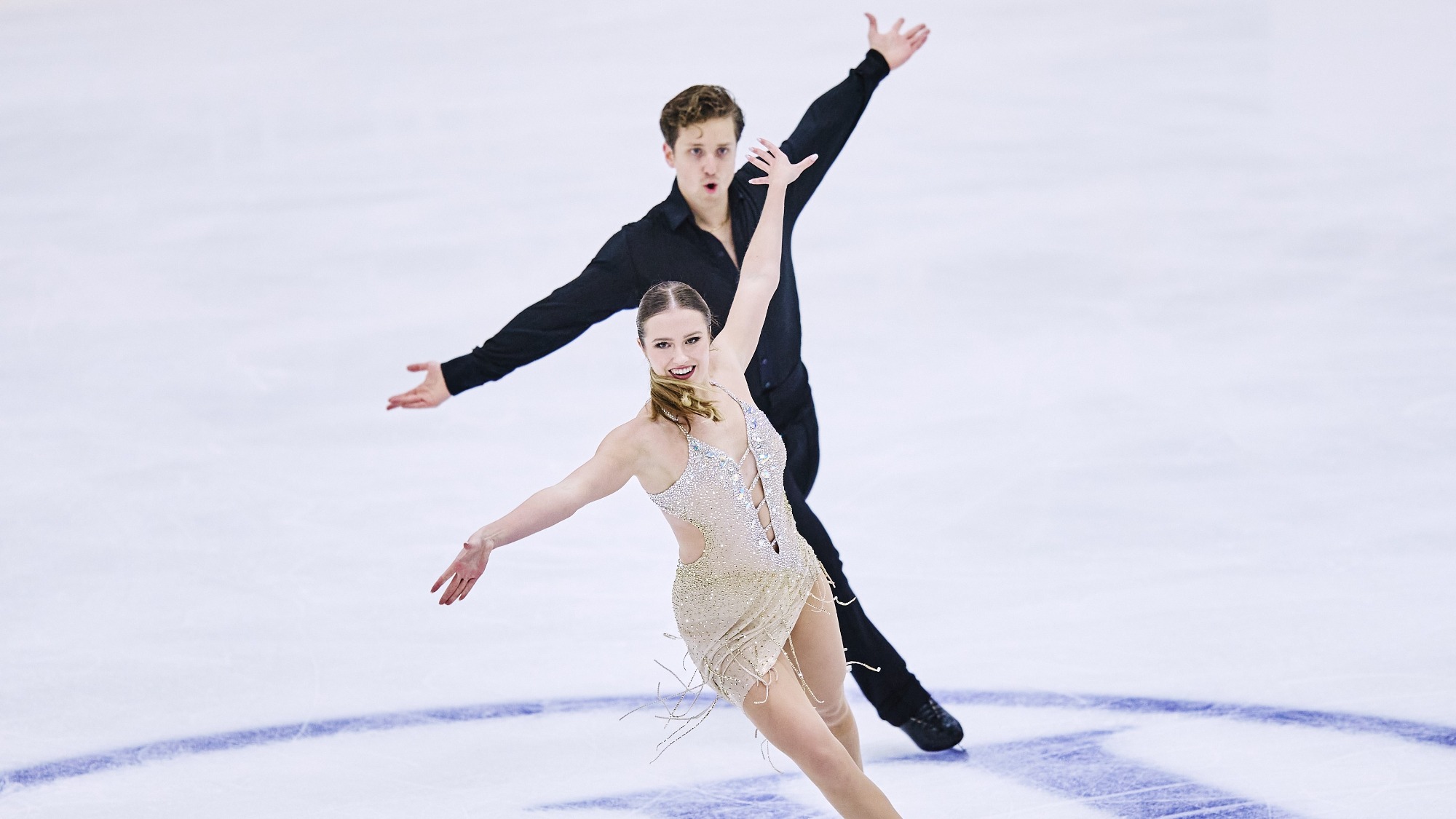 Christina Carreira and Anthony Ponomarenko of the United States compete in the short program at MK John Wilson Trophy, Christina skating in front of Anthony.
