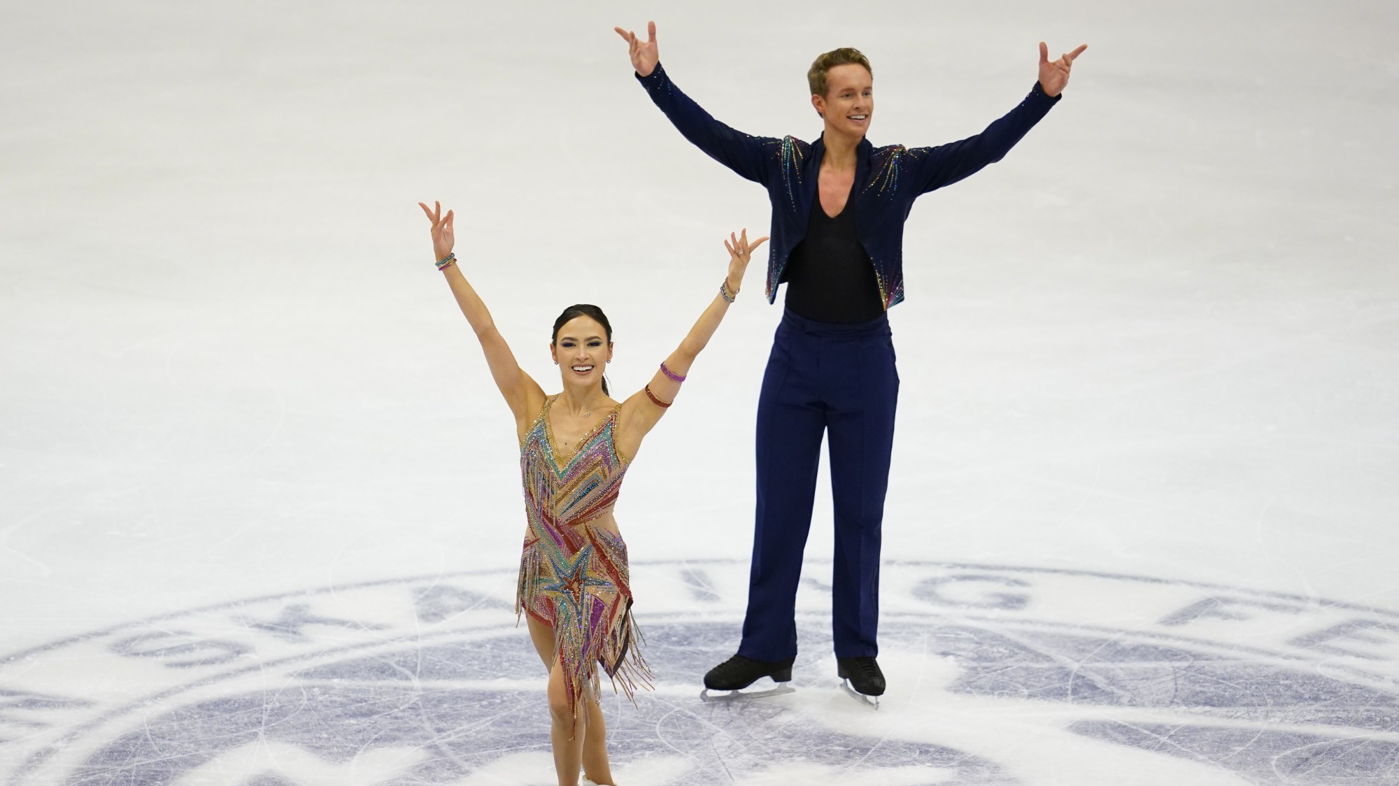 Madison Chock and Evan Bates at center ice during their final bows at NHK Trophy.
