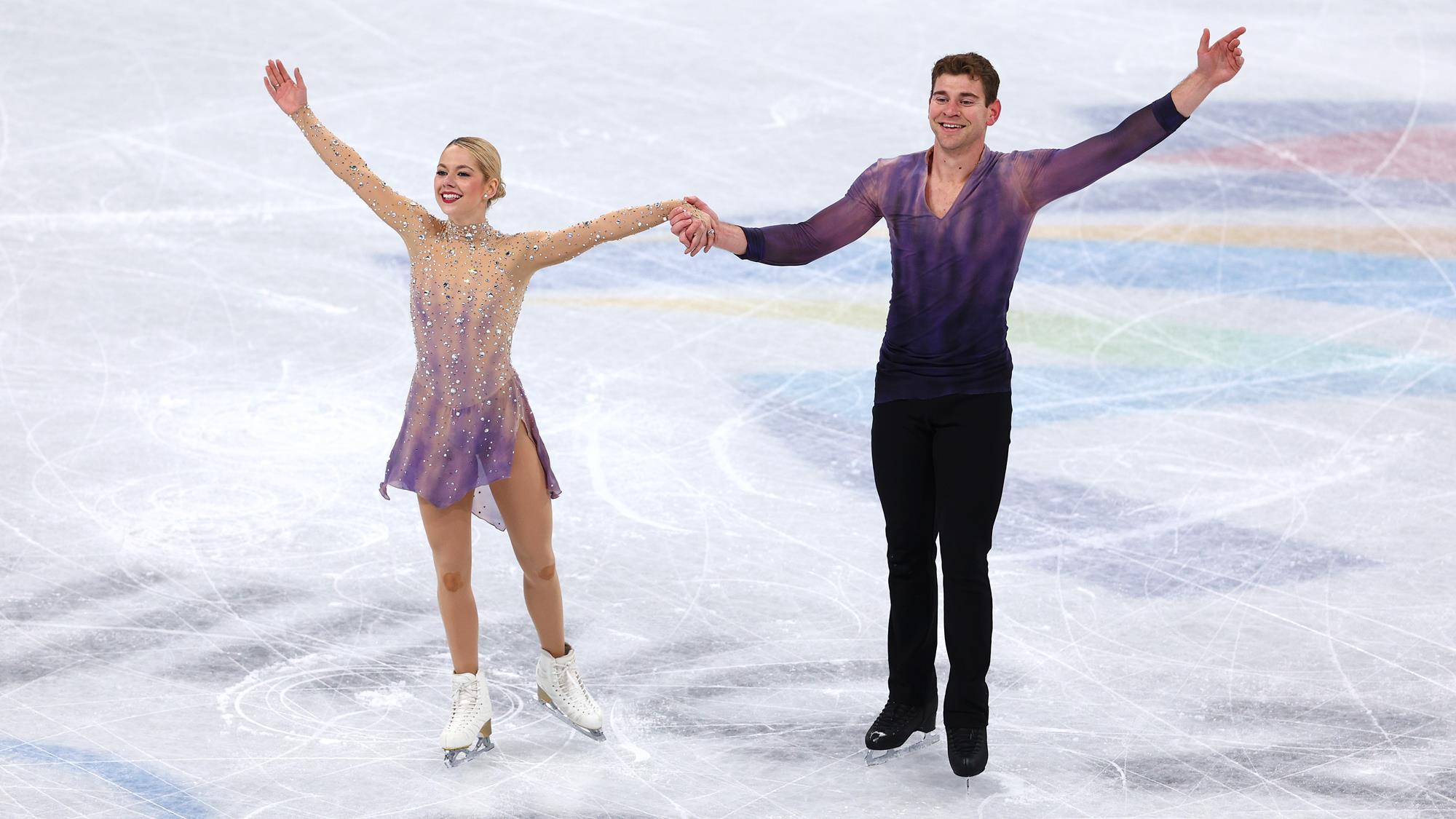 Alexa Knierim and Brandon Frazier smile during their bows after their free skate.