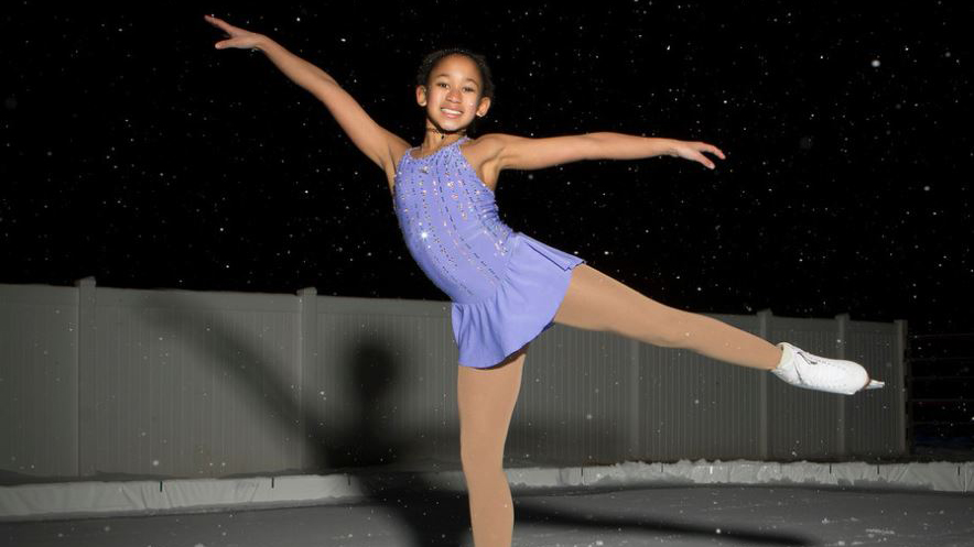 Kate Pressgrove poses at an outdoor rink in the snow