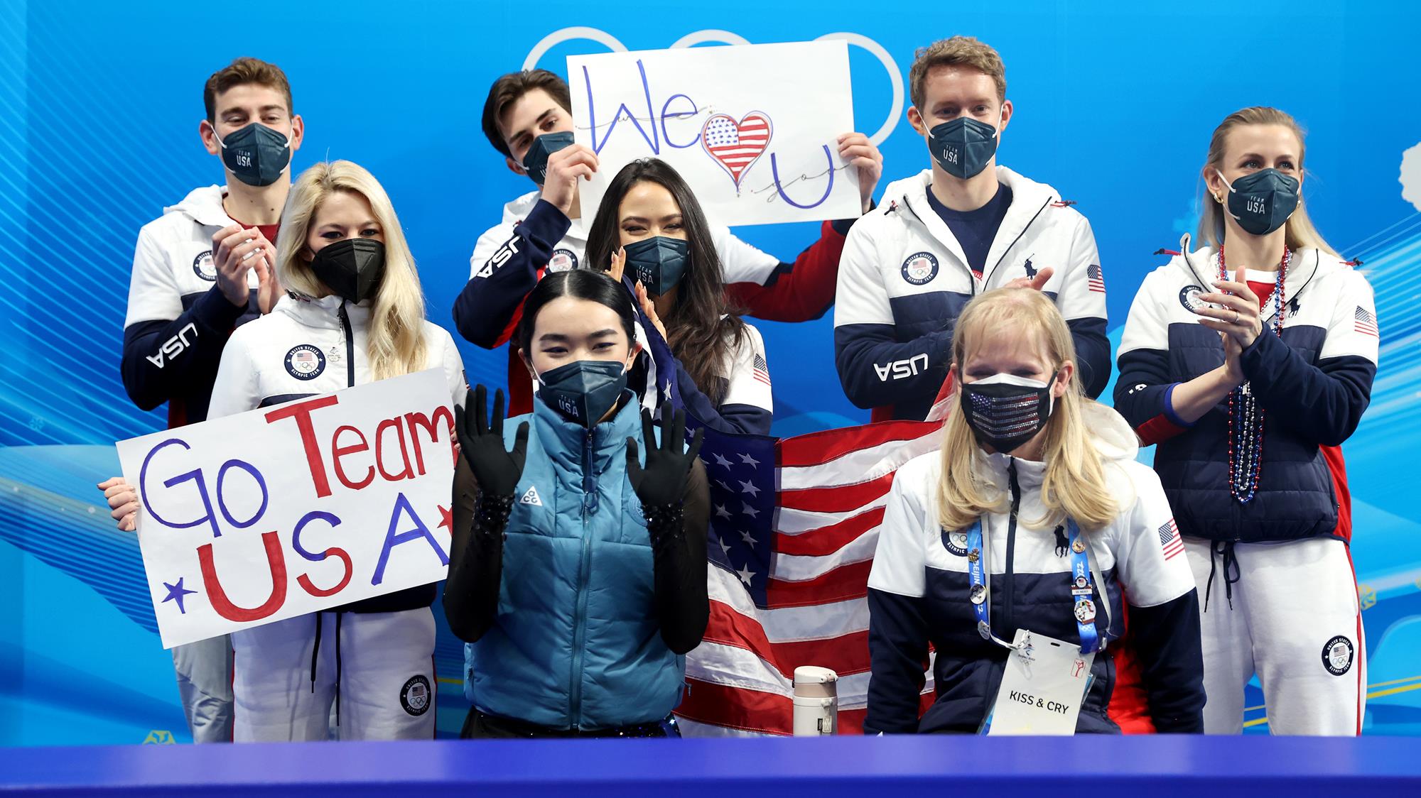 Brandon Frazier, Zachary Donohue, Evan Bates, Madison Hubbell, Alexa Knierim and Madison Chock cheer on Karen Chen in the kiss and cry during the Olympic Team Event in Beijing