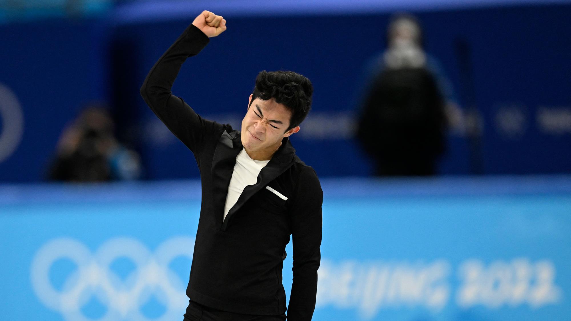 Nathan Chen pumps his fist after finishing his short program at the Olympic Winter Games Beijing 2022