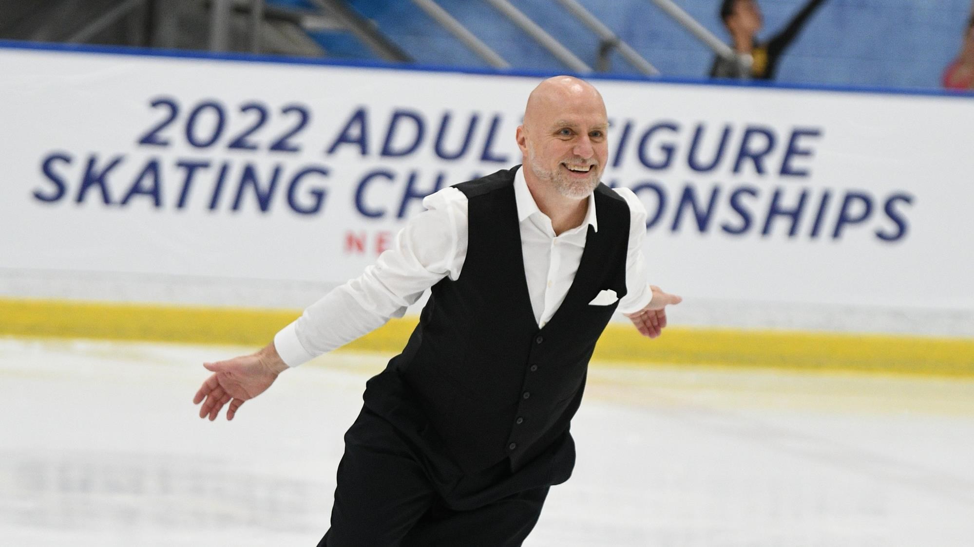 Dean Wiles with a big smile on his face as he skates at the 2022 U.S. Adult Figure Skating Championships presented by Prevagen