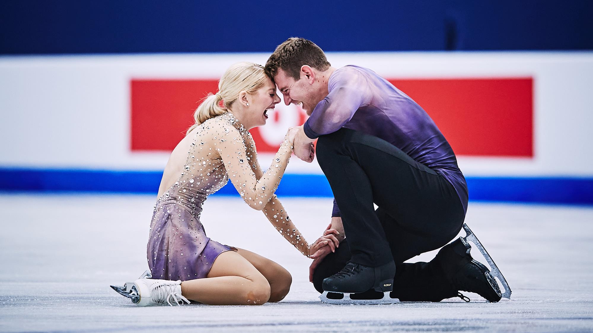 Alexa Knierim and Brandon Frazier celebrate together on the ice after their free skate at the 2022 World Championships