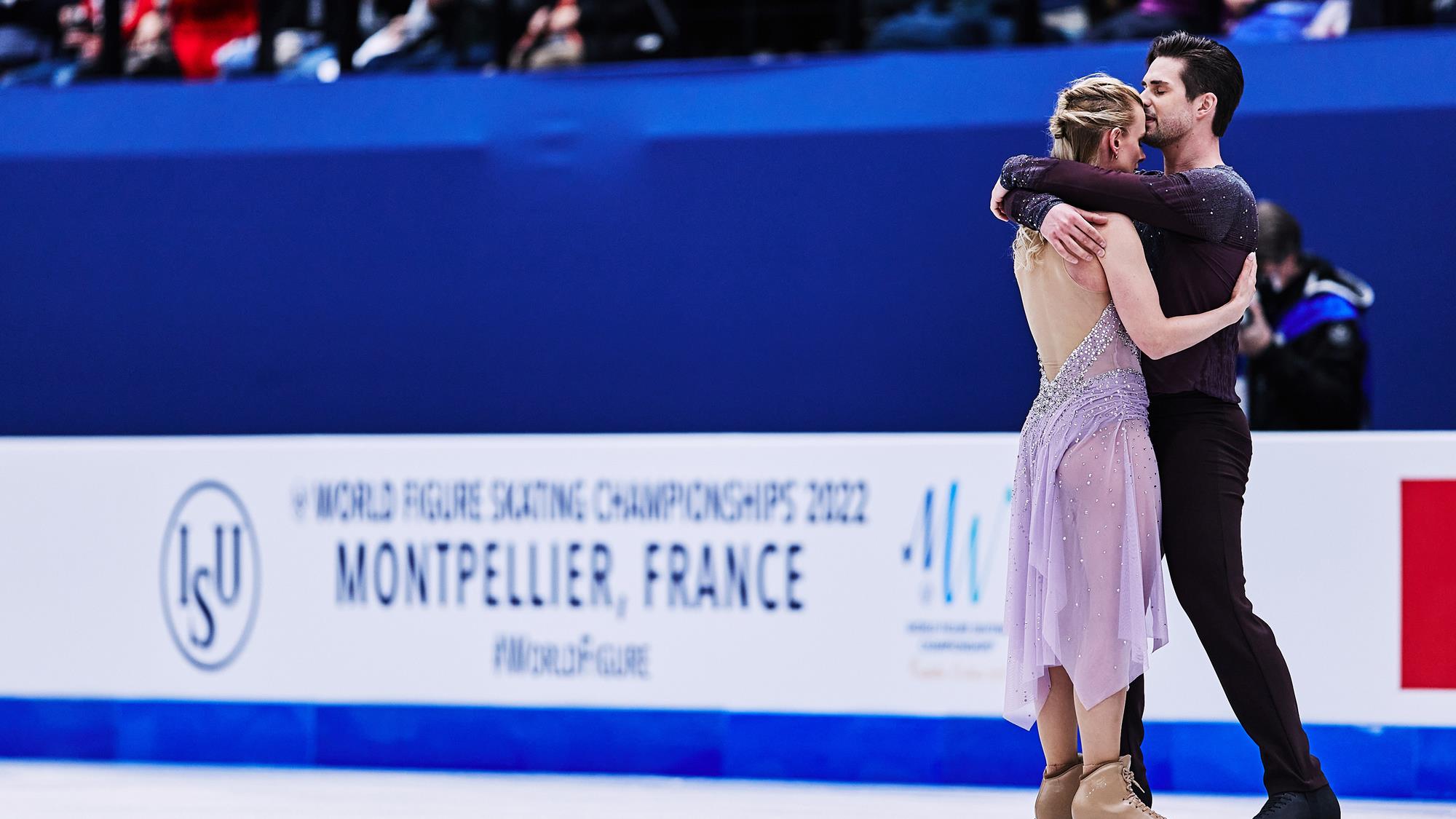 Madison Hubbell and Zachary Donohue embrace following the final performance of their career at the 2022 World Championships