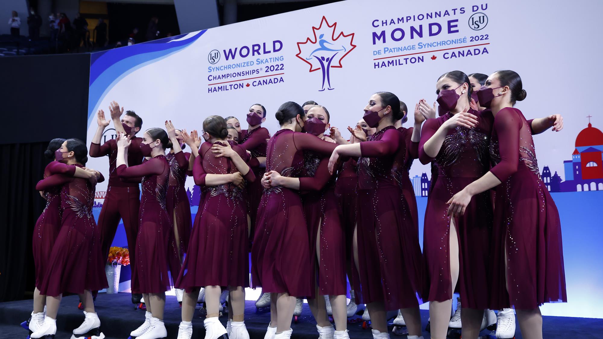 The Haydenettes celebrate in the kiss and cry after receiving their scores