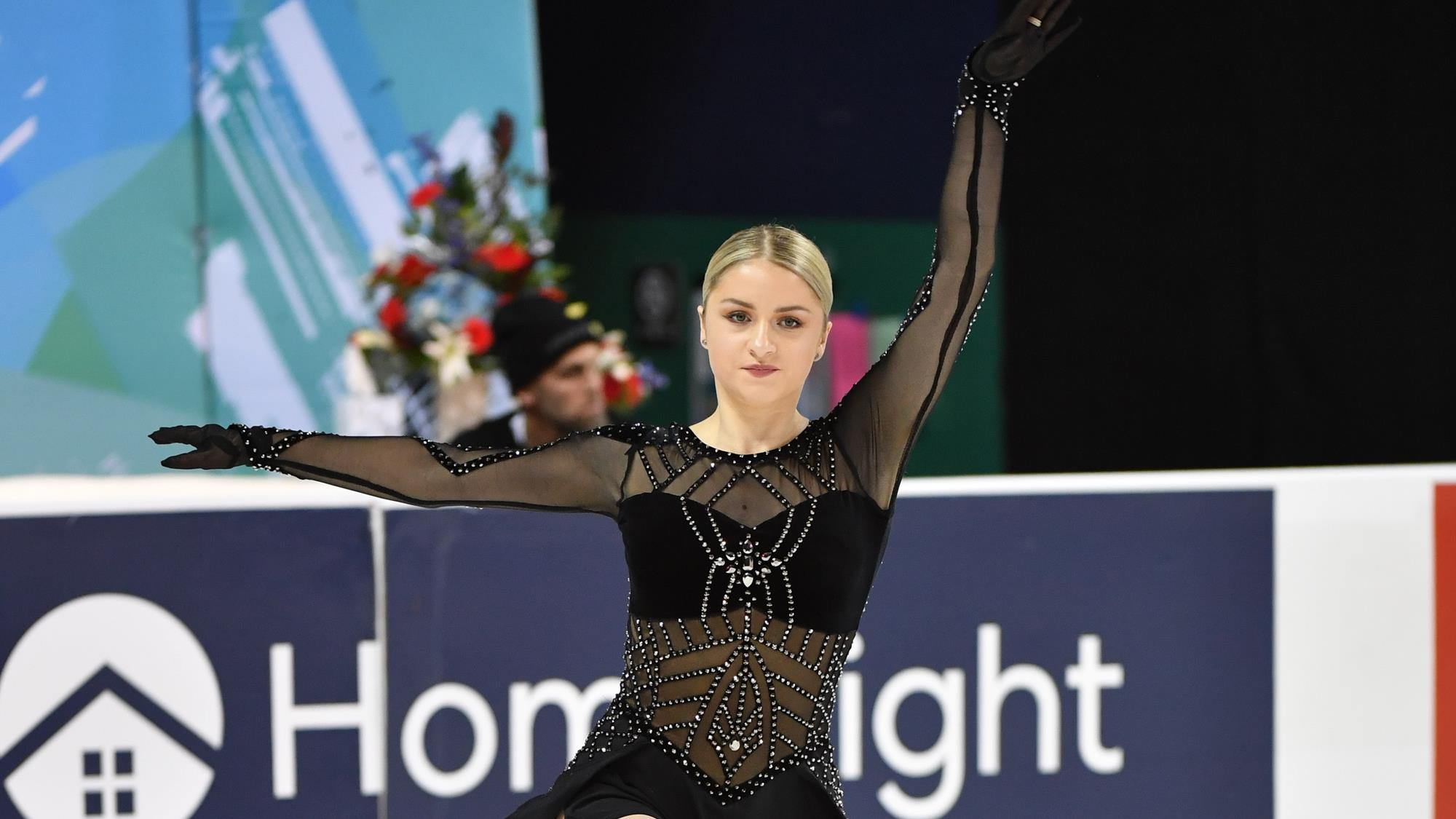 Paige Rydberg skates across the ice in a black rhinestoned dress at the 2020 U.S. Figure Skating Championships