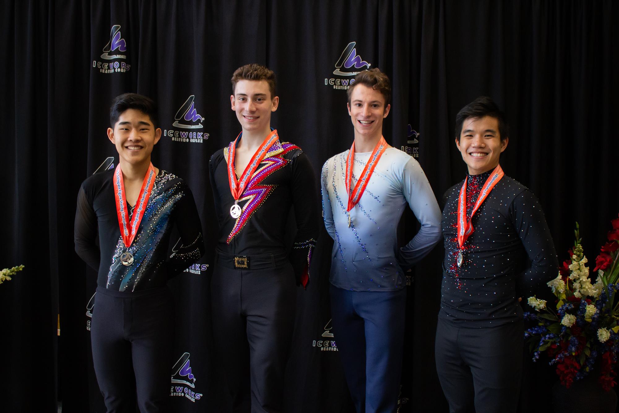 Ryan Dunk (second from the left) standing on the podium after receiving his gold medal at the 2021 Collegiate Championships.