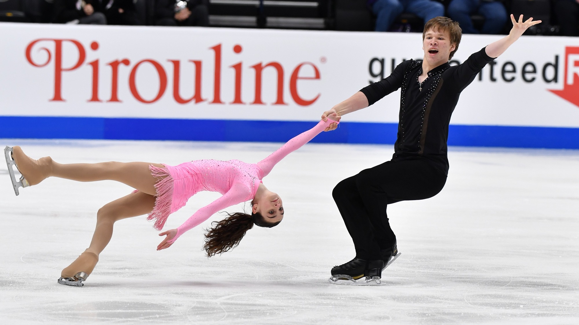 Sonia Baram and Daniel Tioumentsev execute a death spiral at the 2022 U.S. Championships.