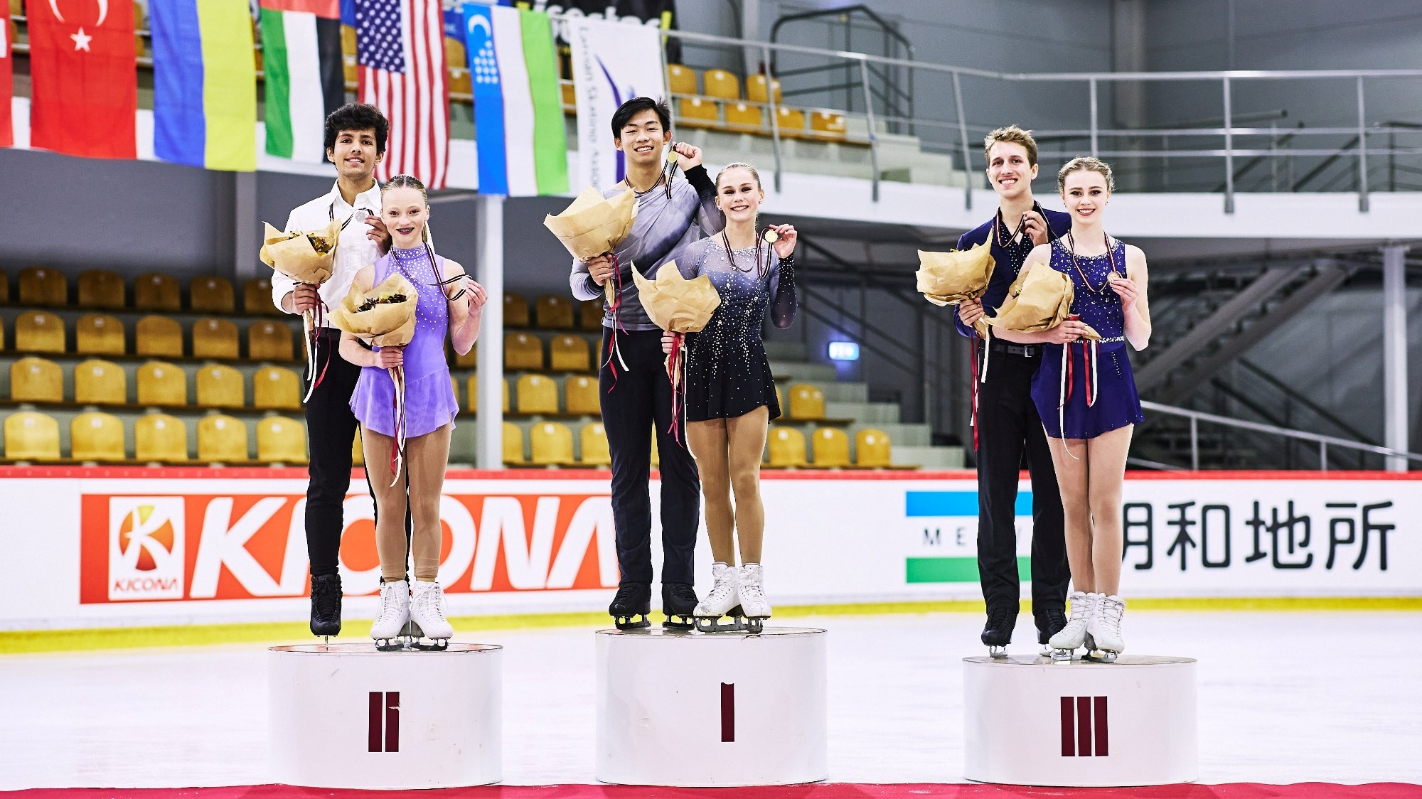 RIGA, LATVIA - SEPTEMBER 09: (L-R) Ava Rae Kemp and Yohnatan Elizarov of Canada, Cayla Smith and Andy Deng of the United States and Ashlyn Schmitz and Tristan Taylor of Canada  pose in the Junior pairs medal ceremony during the ISU Junior Grand Prix of Figure Skating at Volvo Sporta Centrs on September 09, 2022 in Riga, Latvia. (Photo by Joosep Martinson - International Skating Union/International Skating Union via Getty Images)