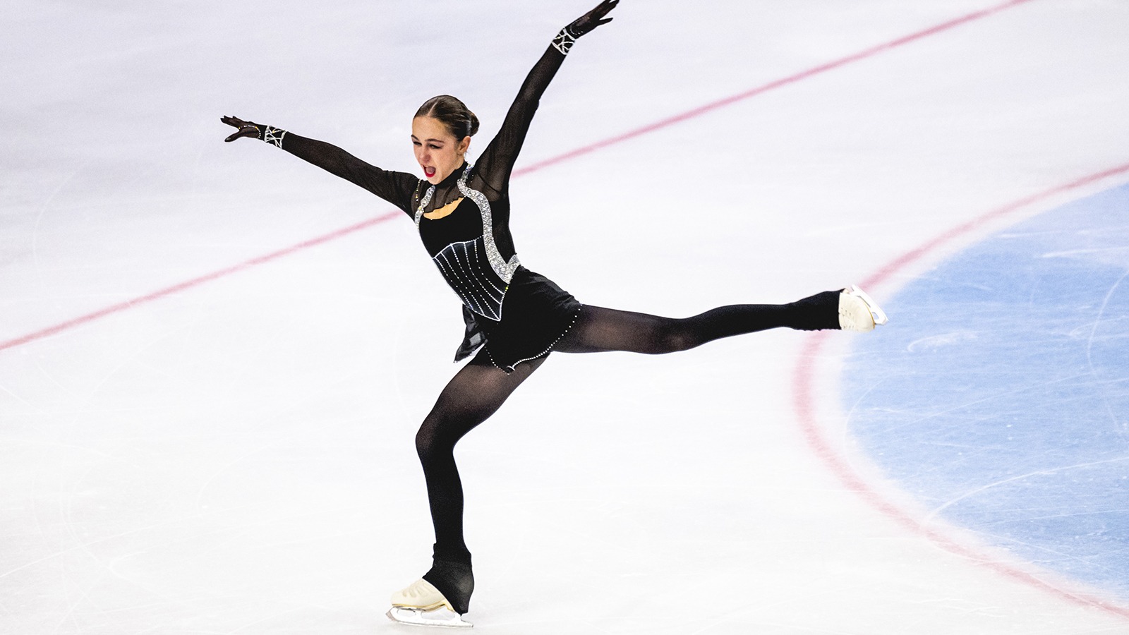 Sophie Joline Von Felten, wearing a black and gray costume, commands the ice with her presentation and expression.