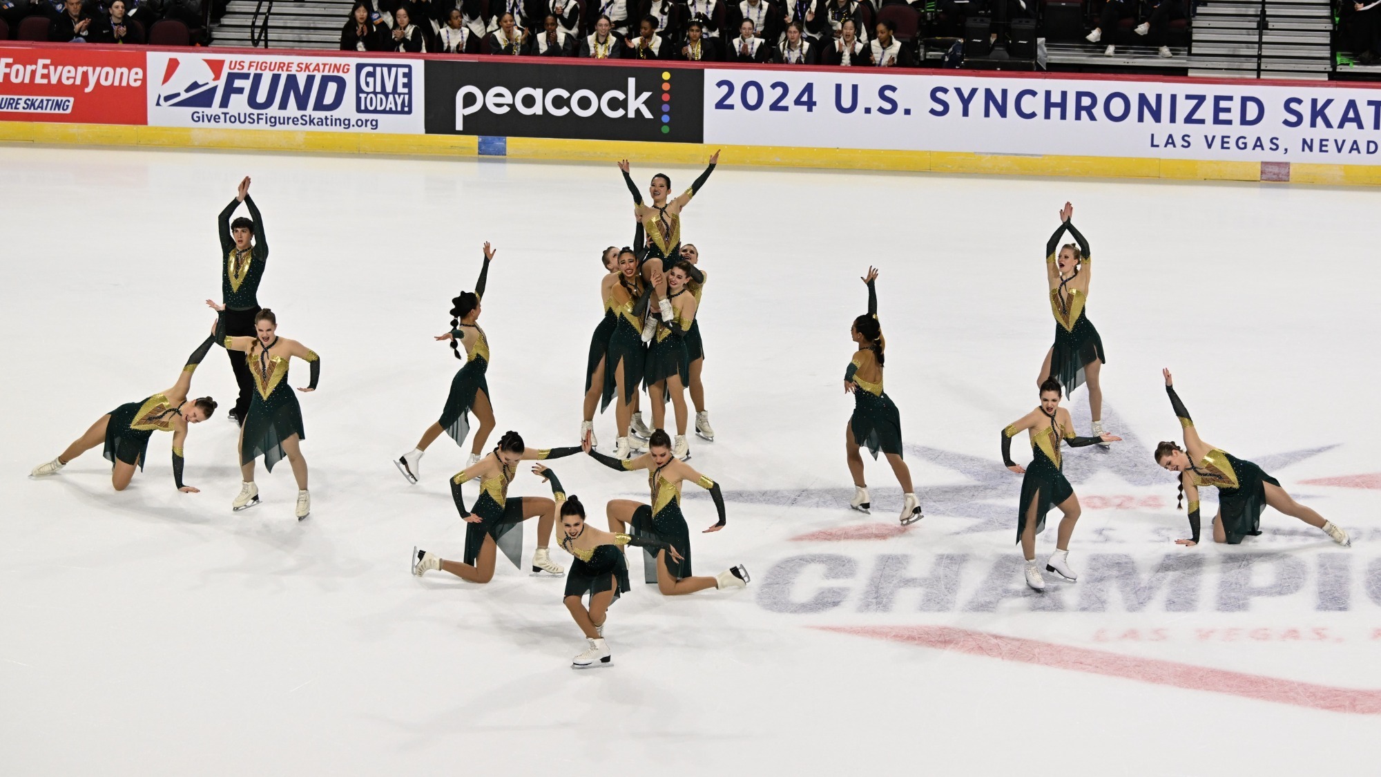 Teams Elite hits its ending pose at center ice after their free skate at the 2024 U.S. Synchronized Skating Championships. 