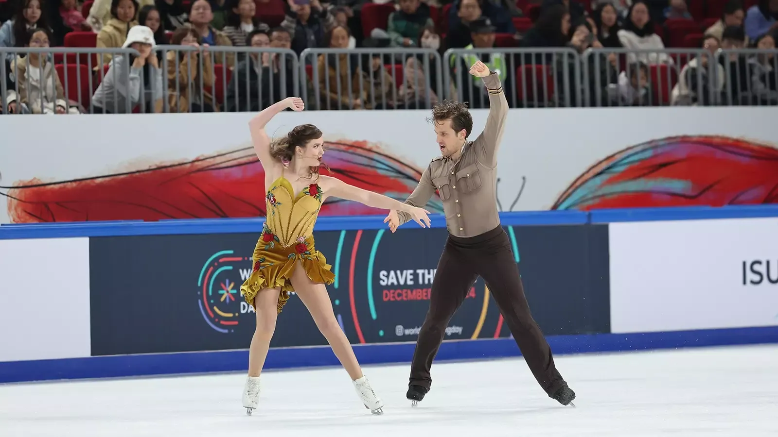 Facing each other, hand in hand, Christina Carreira and Anthony Ponomarenko perform the 