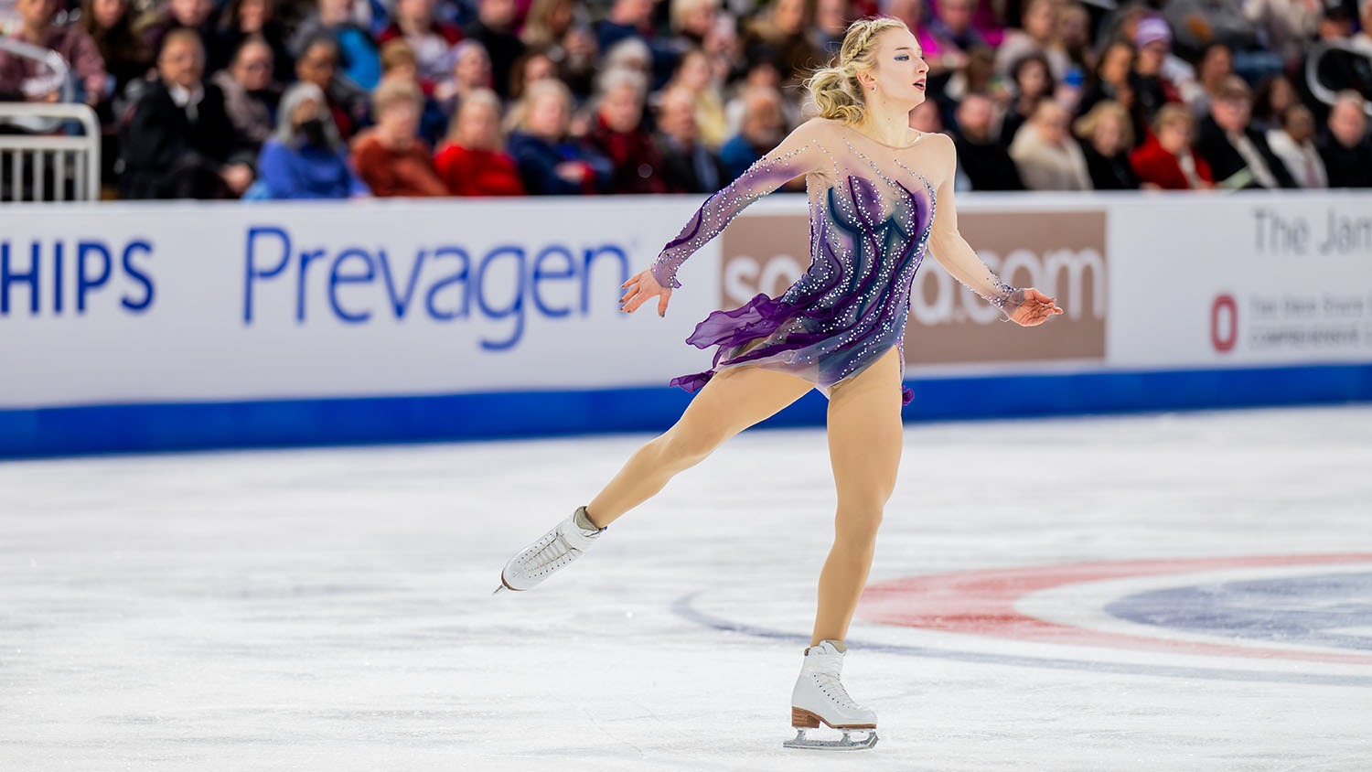 Amber Glenn, wearing a purple dress, skates to the right during the free skate at the U.S. Championships.