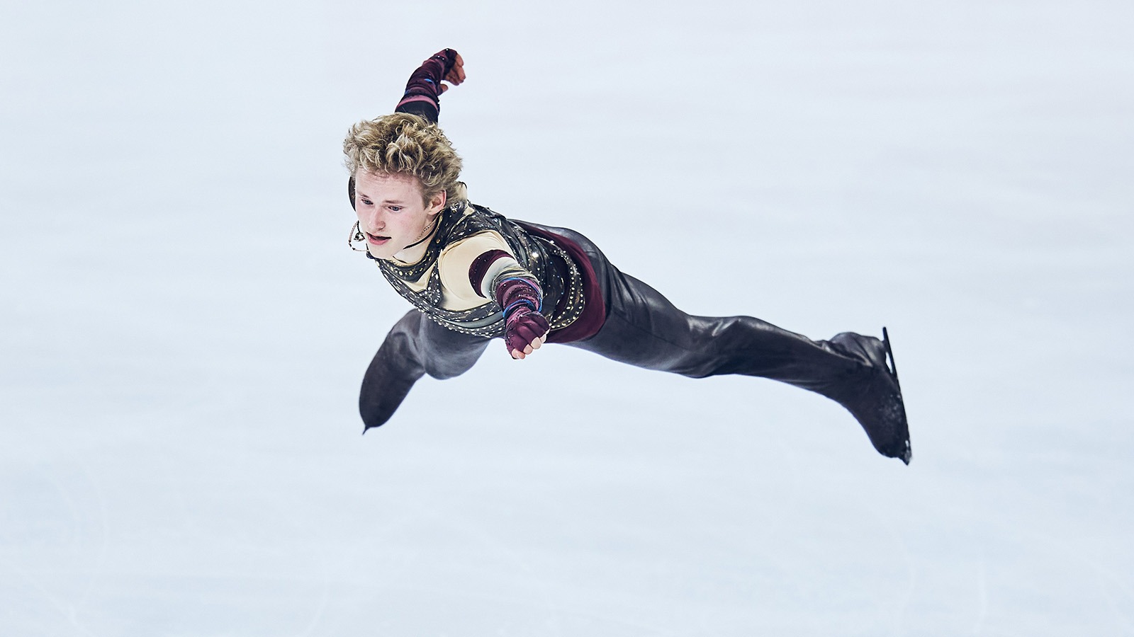 Ilia Malinin flies through the air at Grand Prix de France