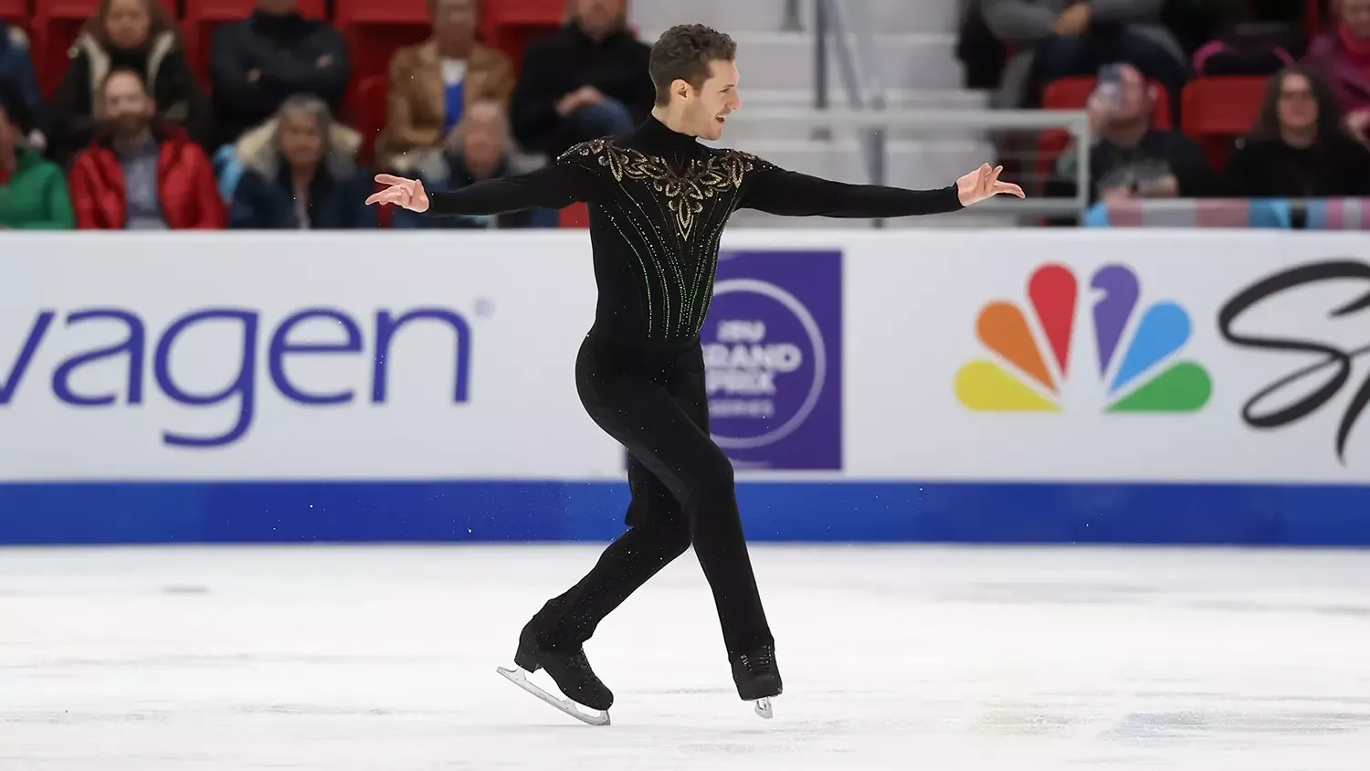 Jason Brown, wearing all black with gold and green detail on the chest, performs 