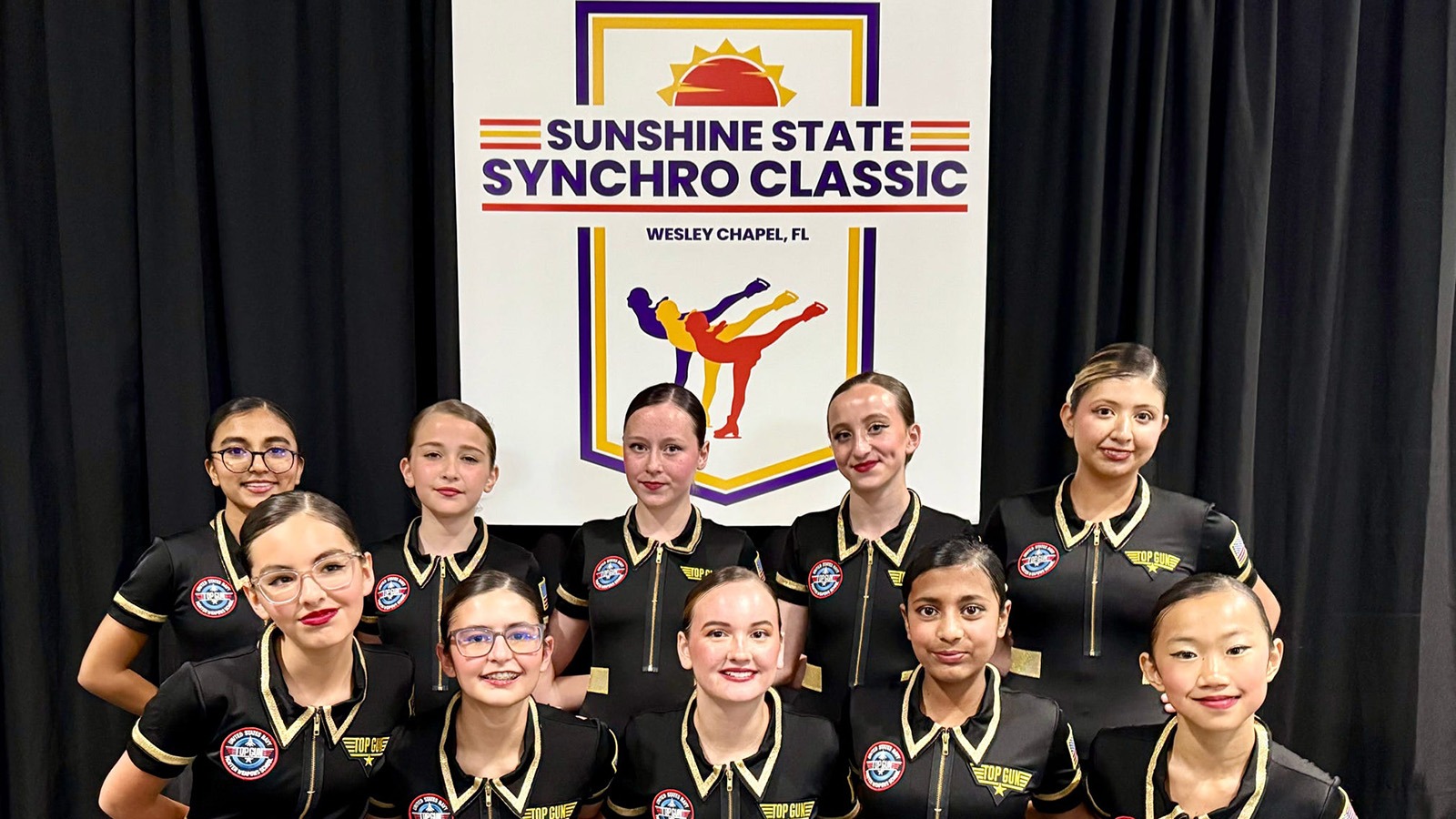 Members of a synchronized skating team from the Sunshine Figure Skating Club, wearing their black 