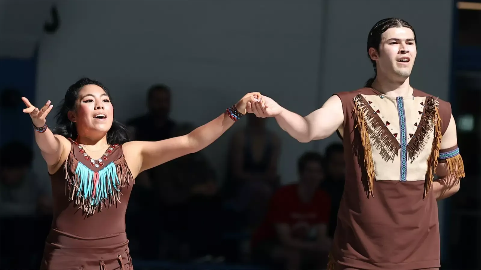 Wearing clothing of her Mayan heritage, Michela Melillo and ice dance partner Karl Schapfel perform a powerful free skate.