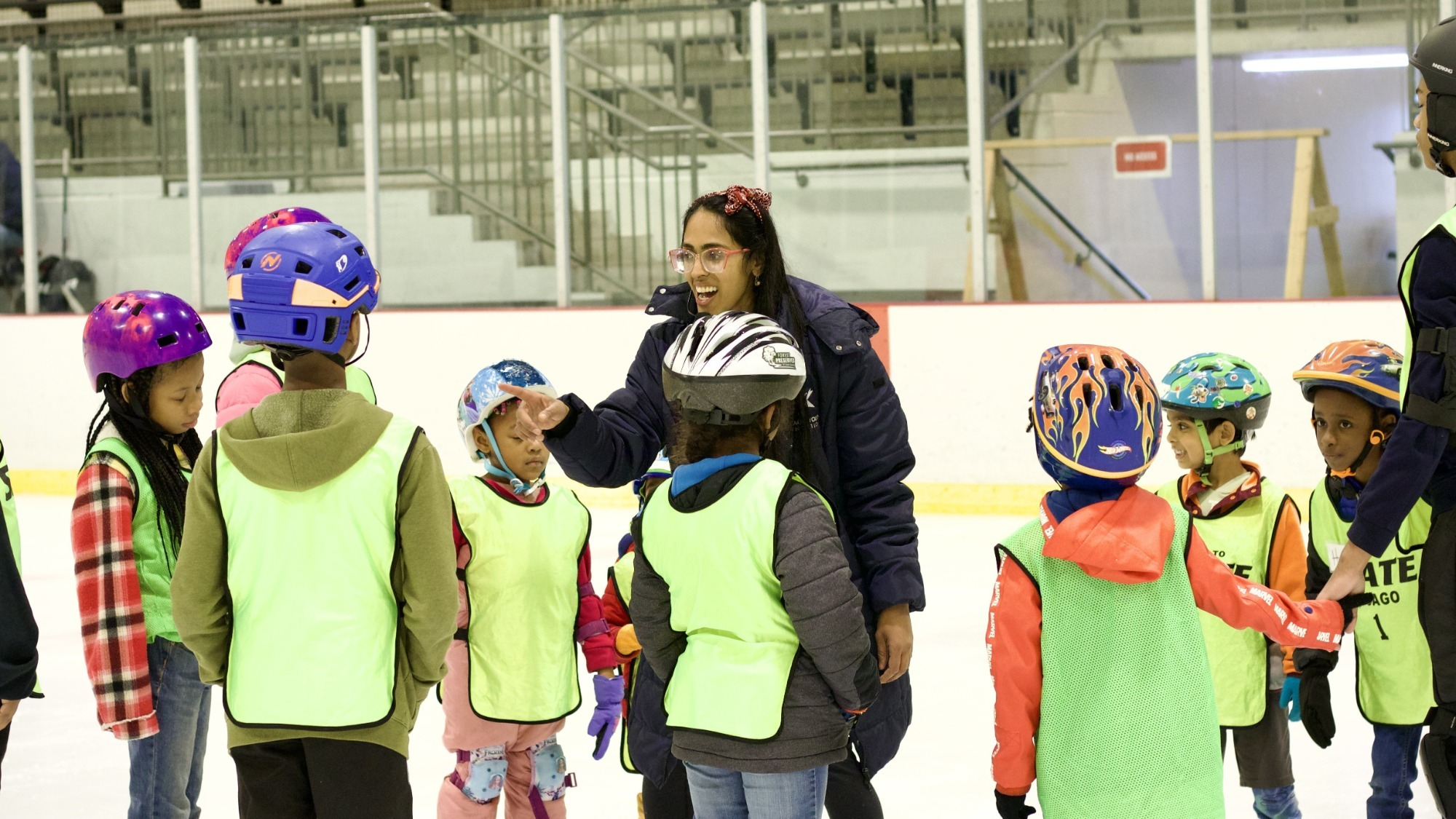 Figure Skating on Your Block Executive Director Dr. Ami Parekh talks with participants in the Learn to Skate program.