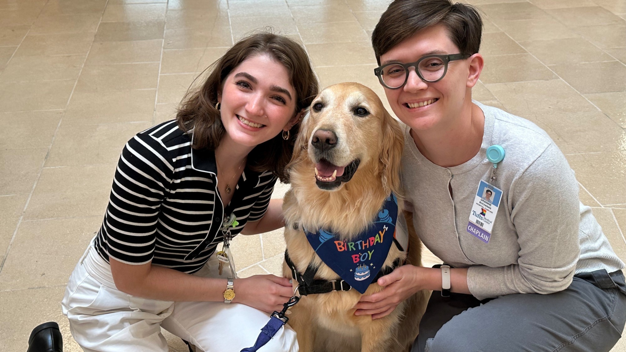 Skyliner Gabriella Romano works as a resource specialist at Tuffts Medical Center. She's pictured with facility dog, Bob, and hospital chaplain, Gráinne Buchanan.