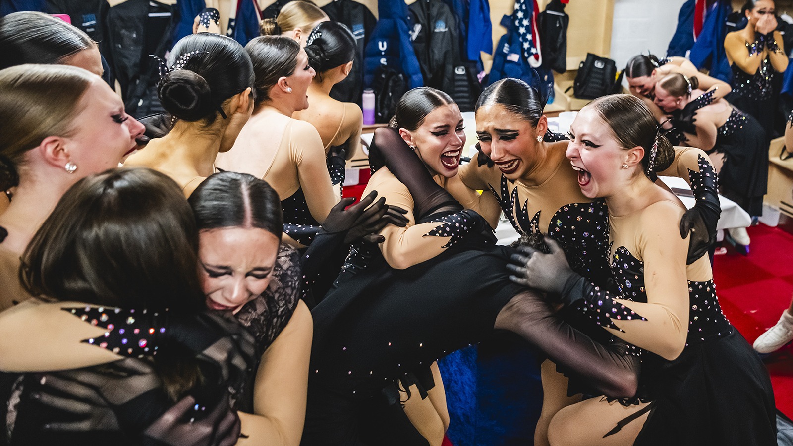 Teams Elite celebrates their historic World medal with embraces, laughter and tears.