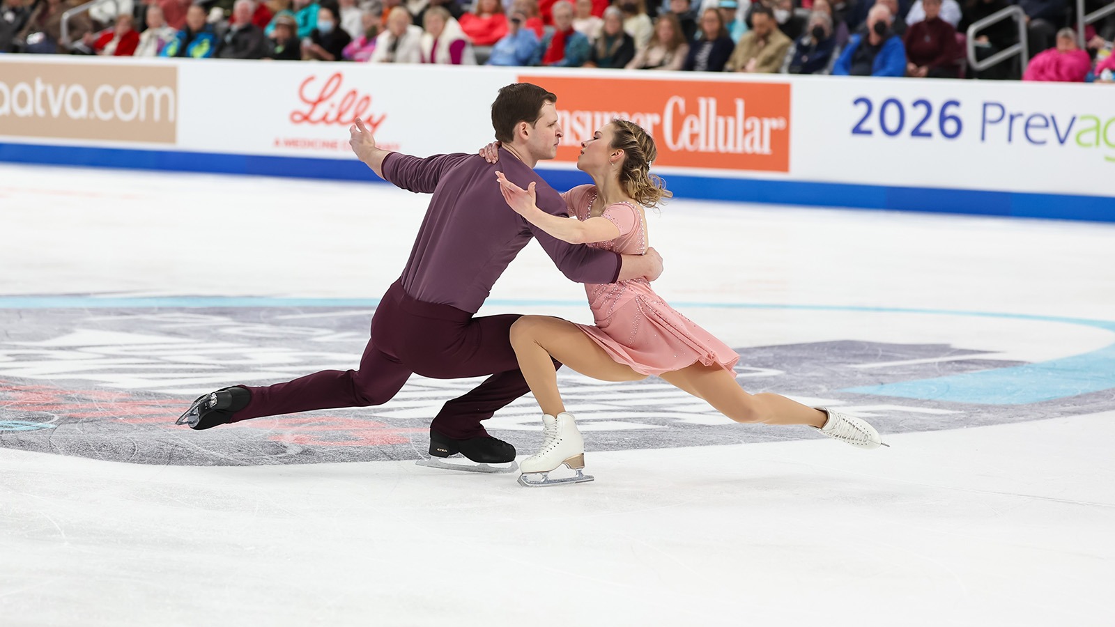  Alisa Efimova and Misha Mitrofanov, with deep knee bends, embrace on the ice in their free skate in St. Louis. 