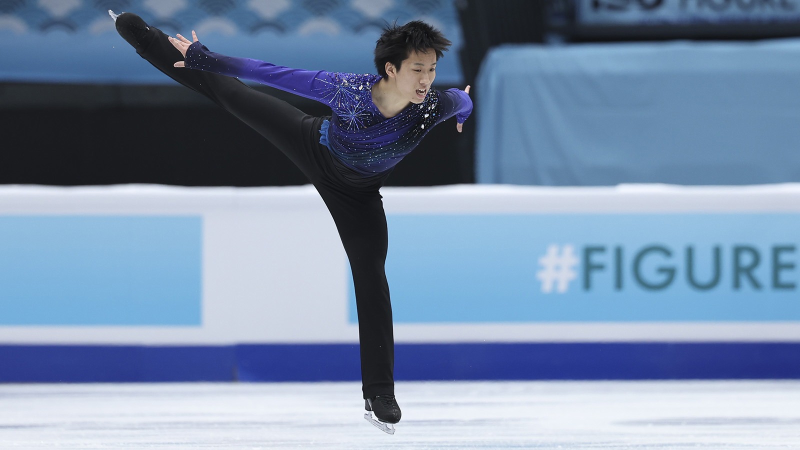 Tomoki Hiwatashi glides on one foot during the free skate at the Four Continents Championships.