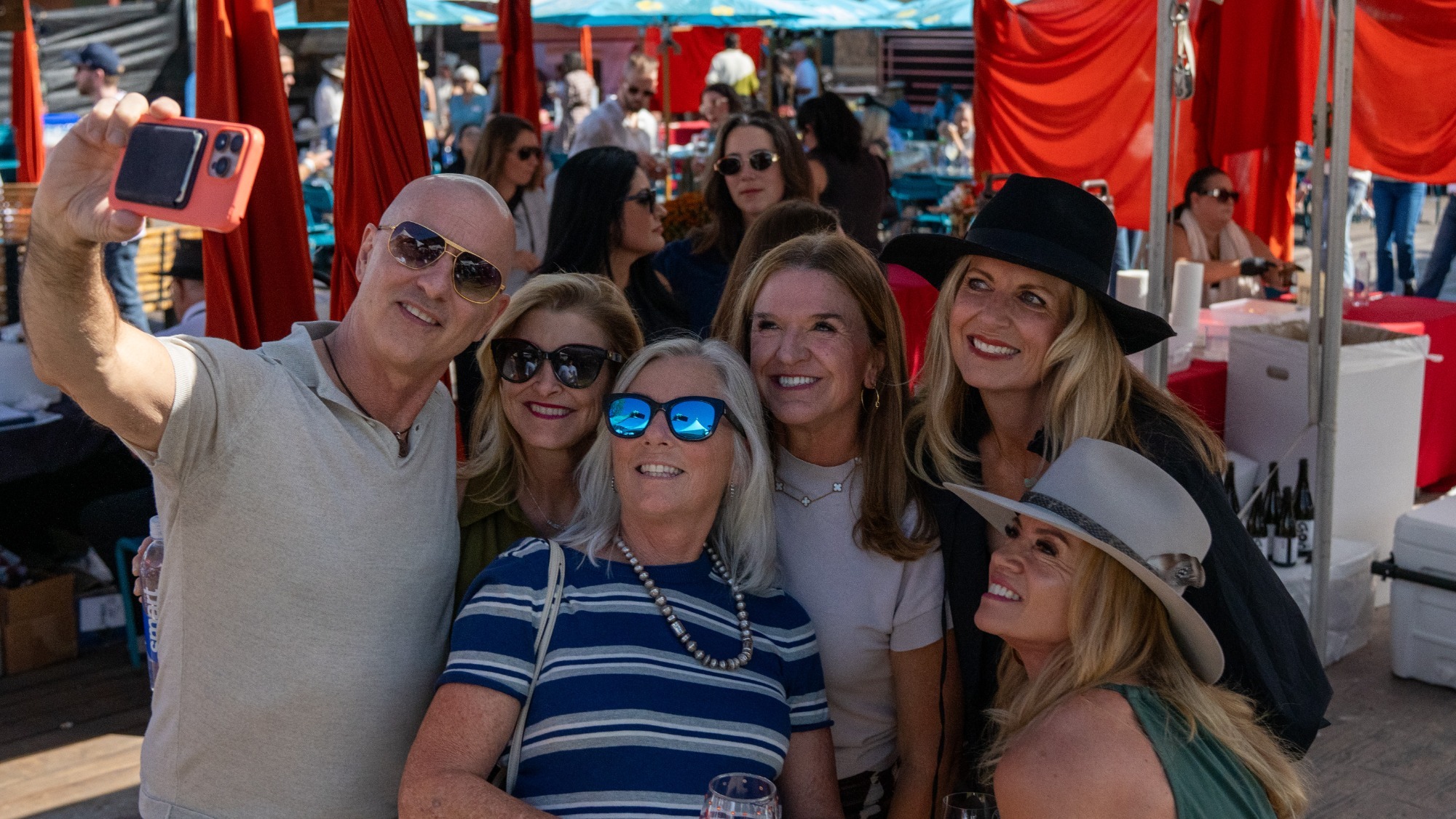 Brian Boitano takes a selfie with a group of women at the Park City Wine Festival.