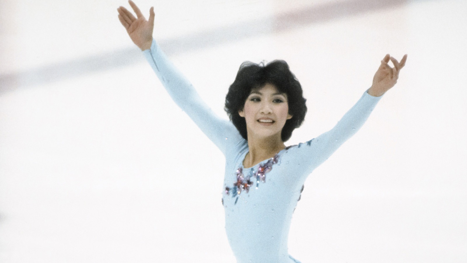Tiffany Chin, dressed in light blue, basks in the moment at the 1984 Olympic Winter Games