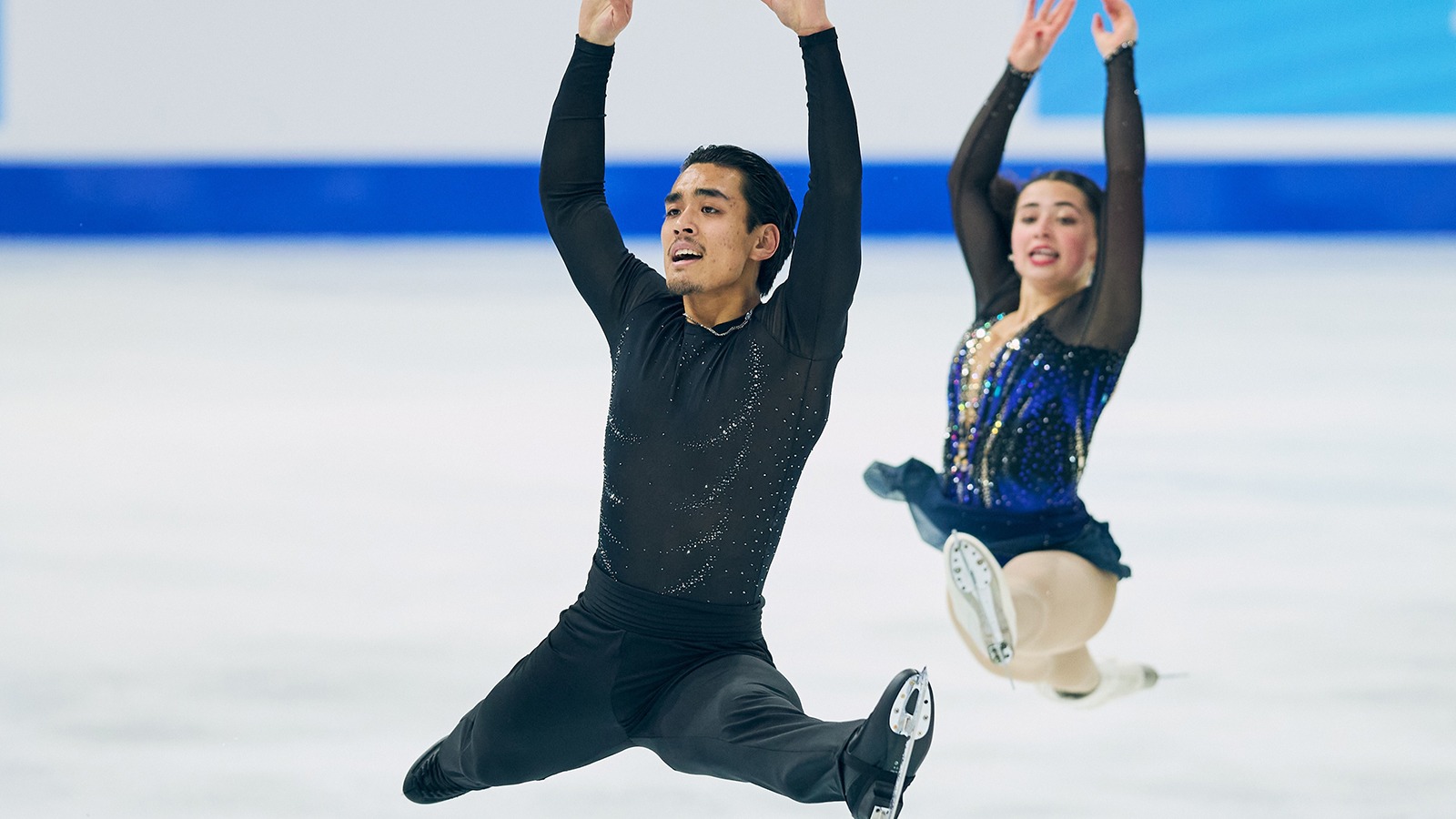 Luke Wang and Olivia Flores fly through the air.