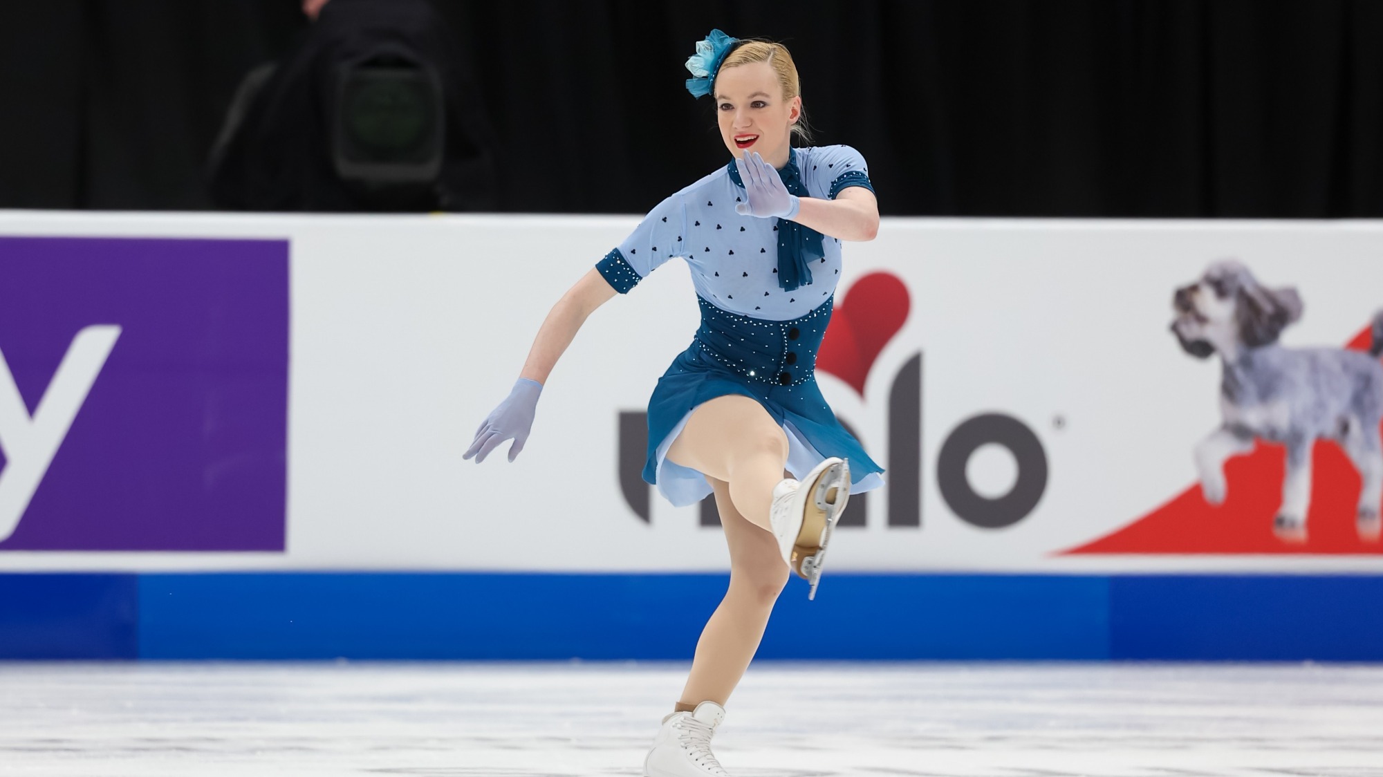 Sonja Hilmer, dressed in blue with white gloves, shows her personality in a costume she created.