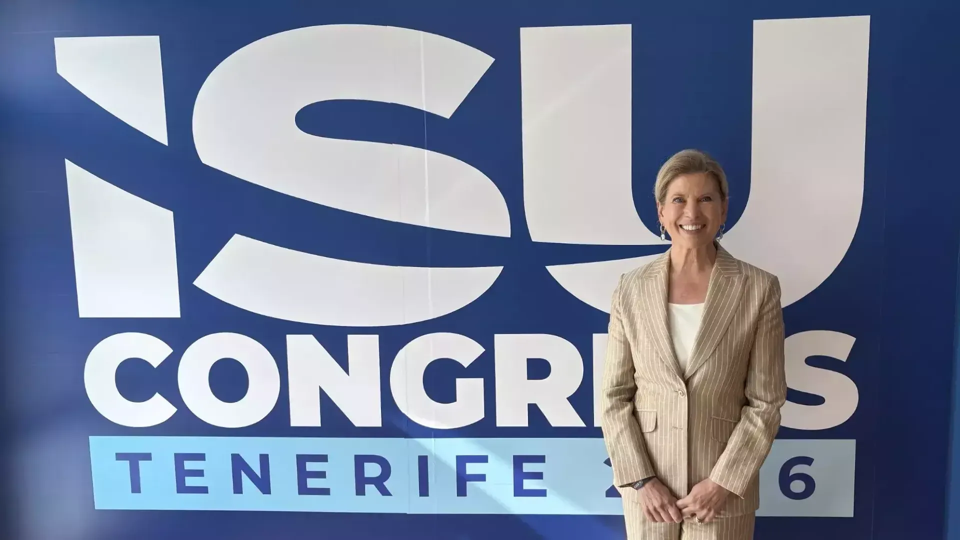 Newly elected ISU Council member Tina Lundgren stands in front of the ISU Congress sign. 