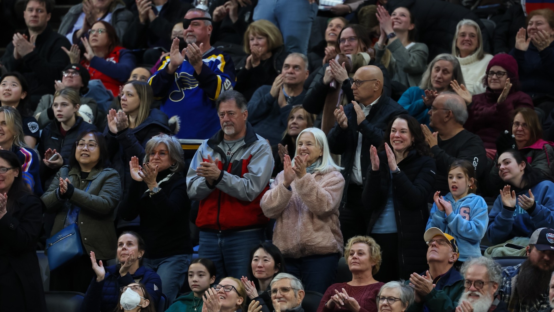 Crowd cheering in the stands. 